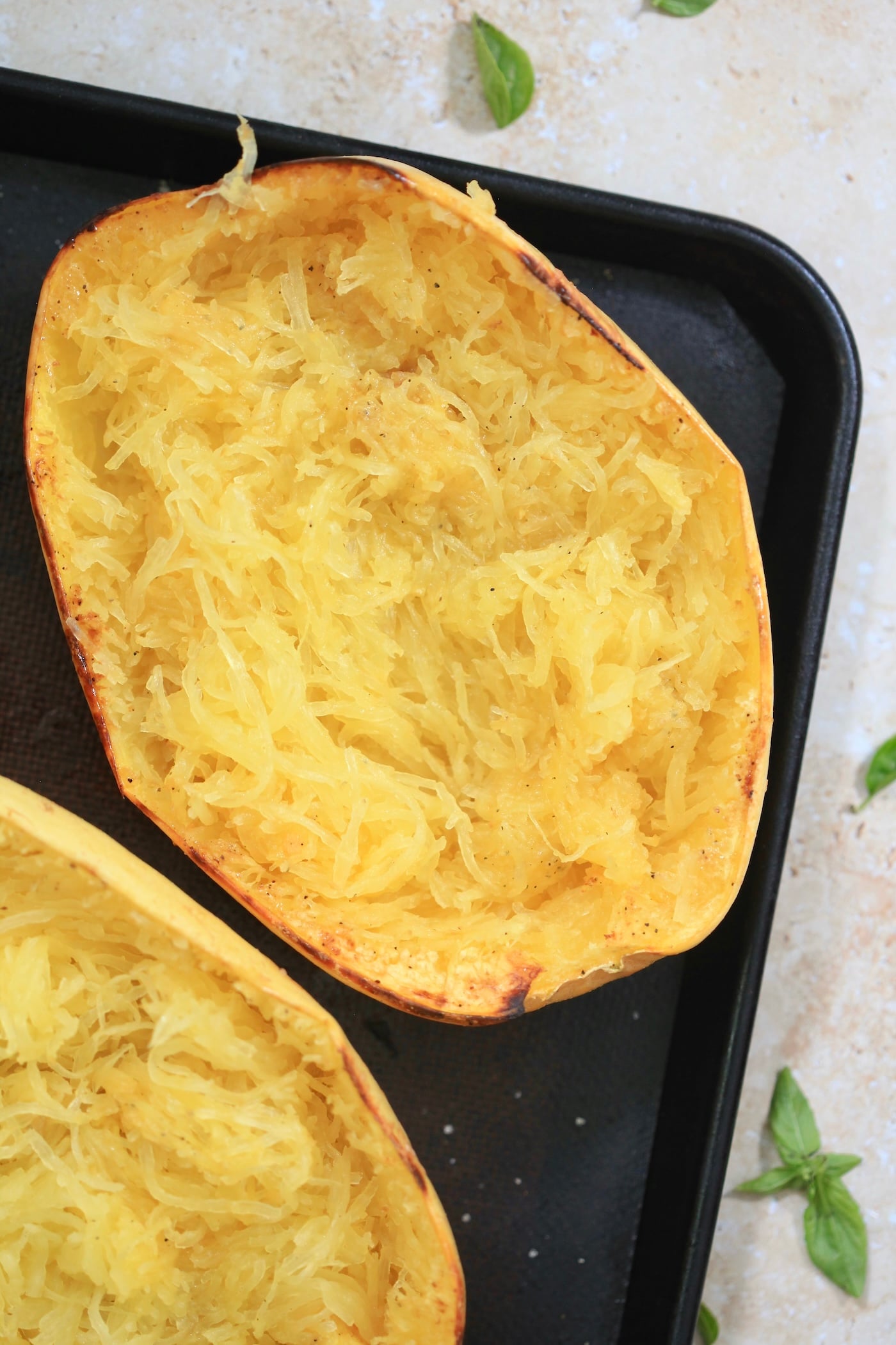 roasted spaghetti squash half on sheet pan