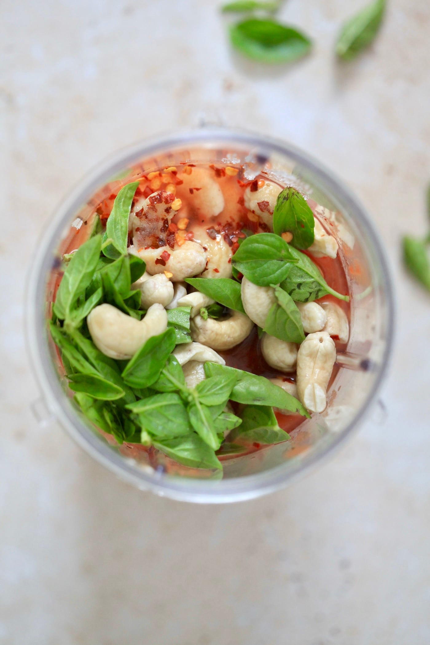 cashews, tomatoes, and basil in blender