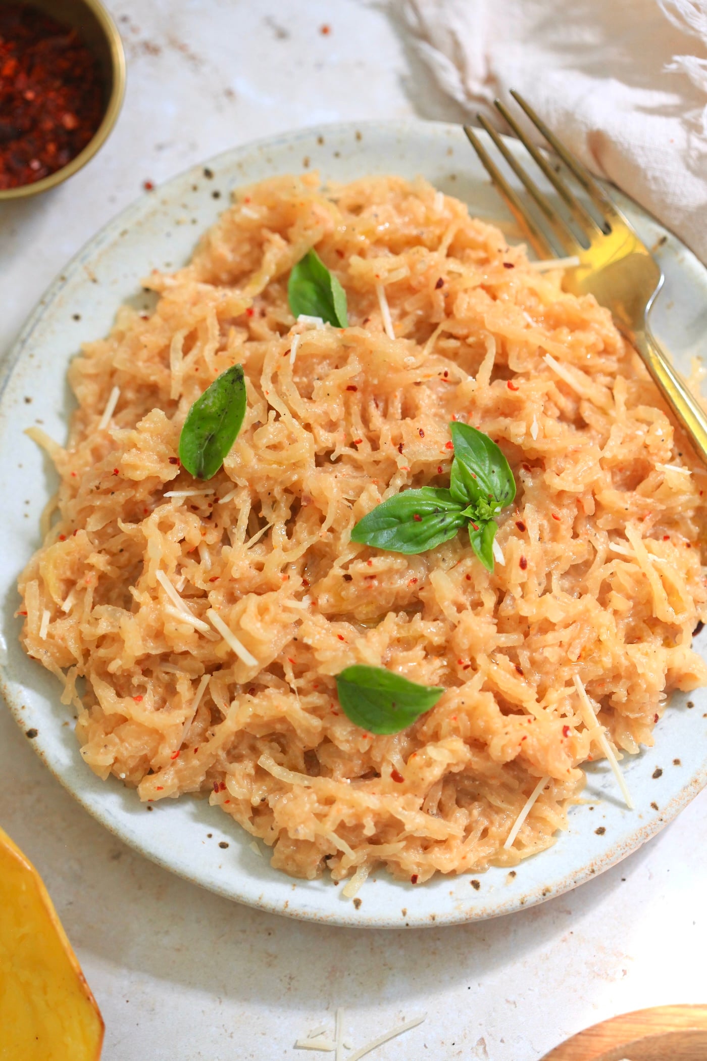 plate of sauced spaghetti squash with basil.