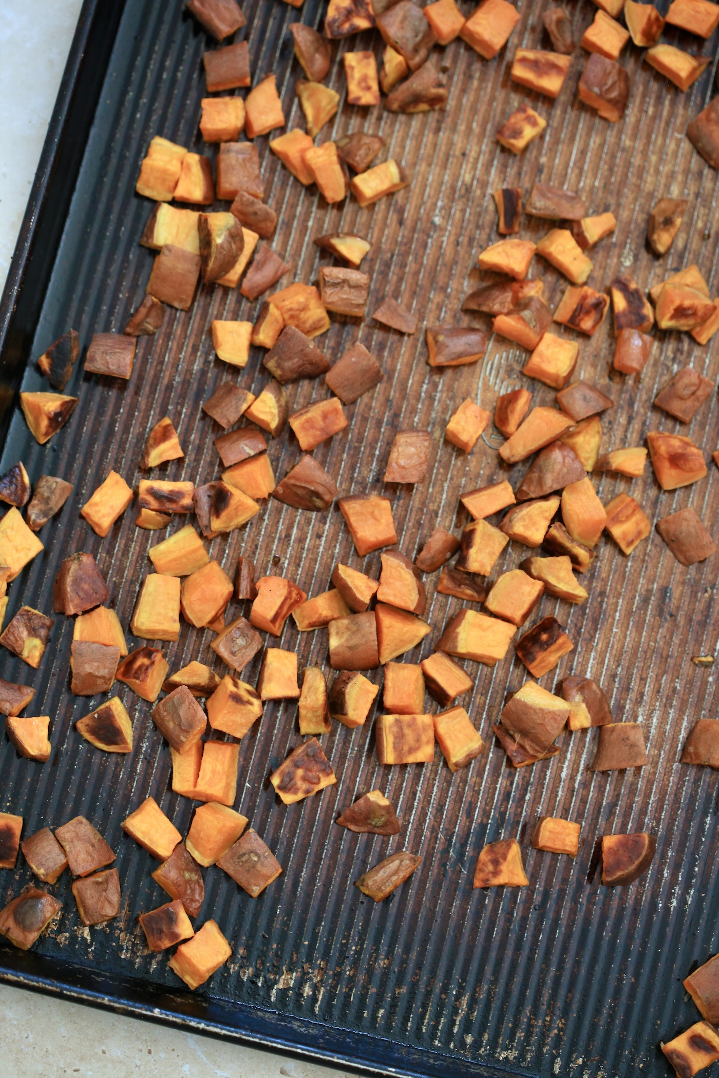 sweet potatoes roasted on sheet pan.