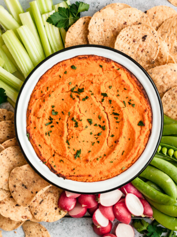 This addictive Healthy Vegan Buffalo Cauliflower Dip is super creamy, decadent, and secretly healthy! You'd never guess it was vegan, gluten-free, and packed with protein. Make it for the big game or as a party appetizer!