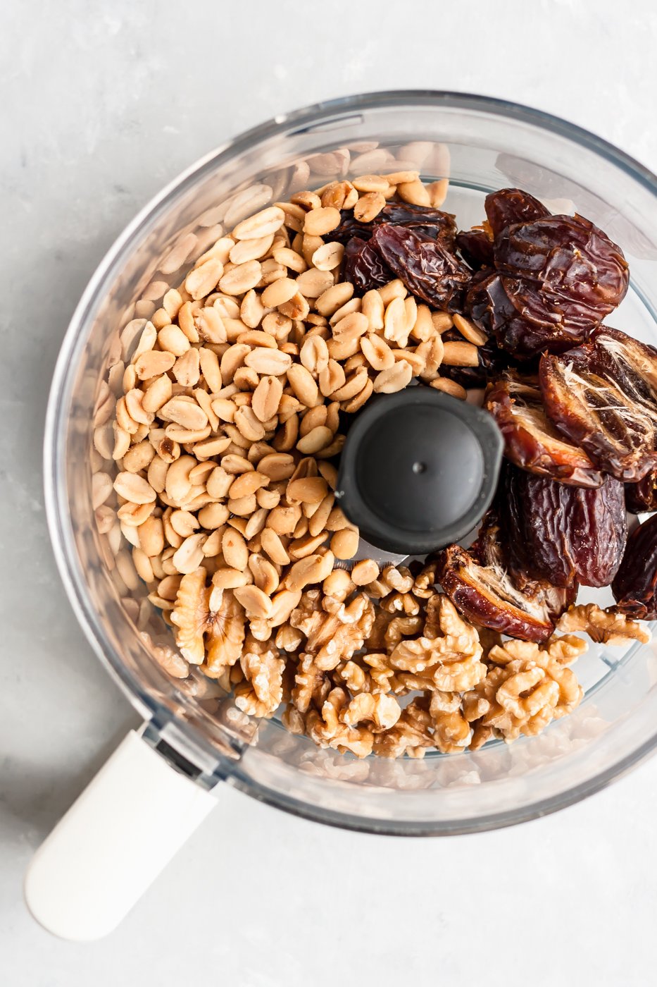 food processor with peanuts and dates