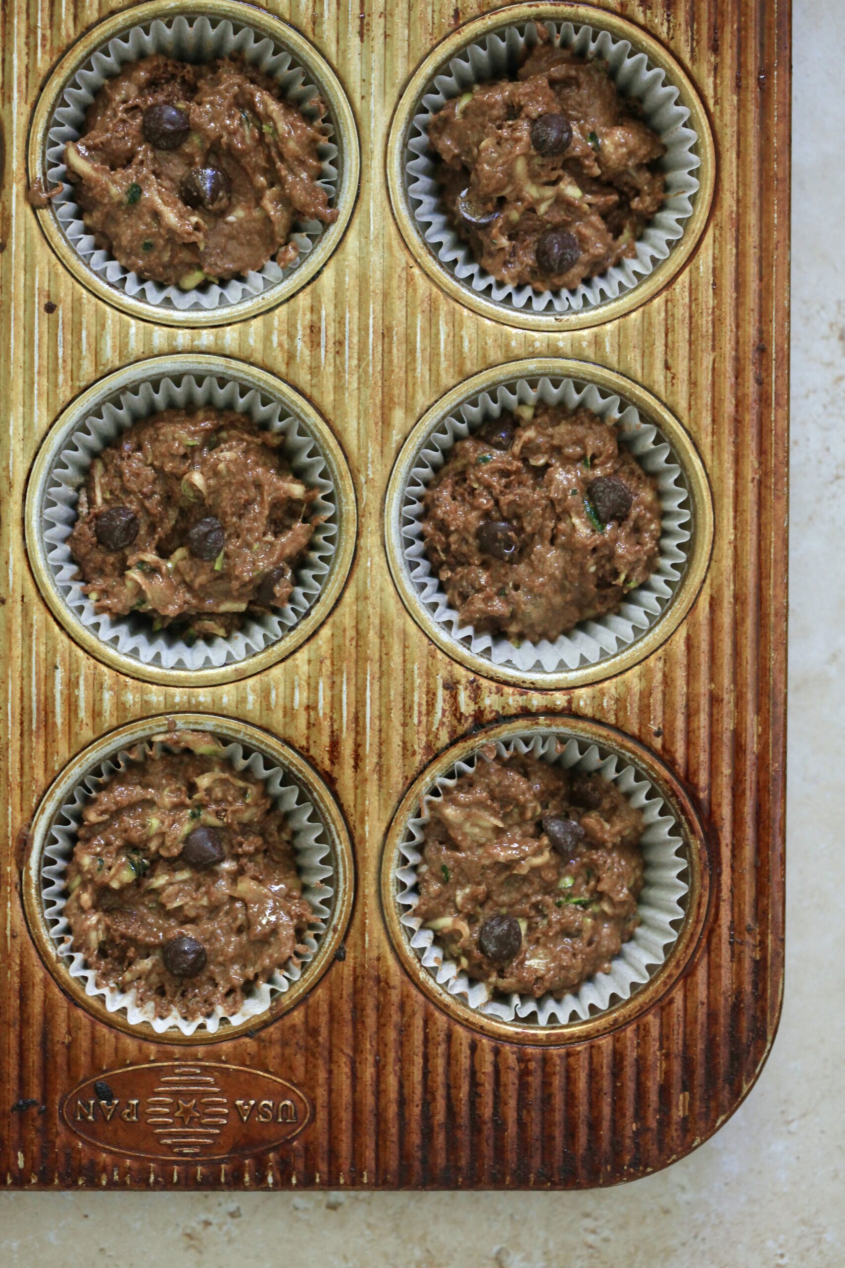unbaked muffins in tin.