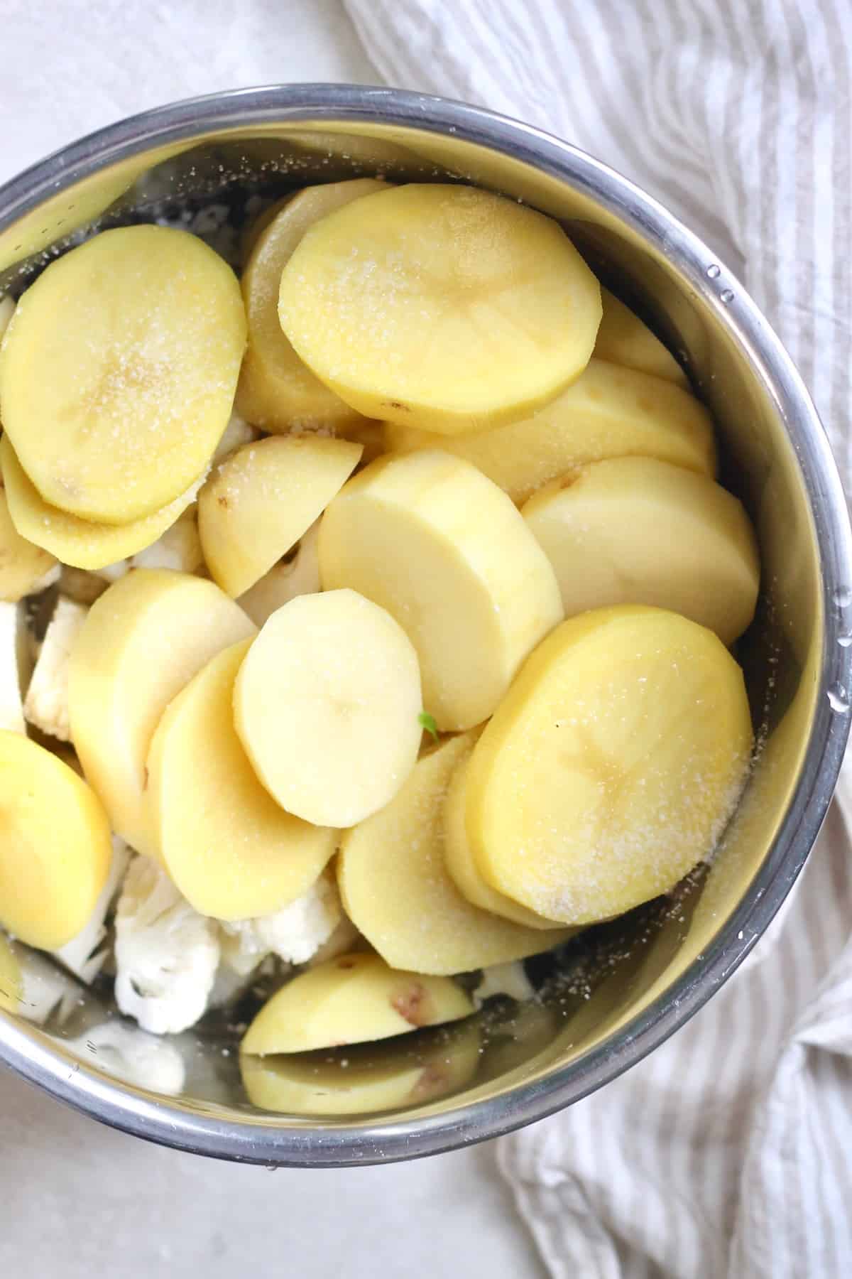 sliced potatoes in pot
