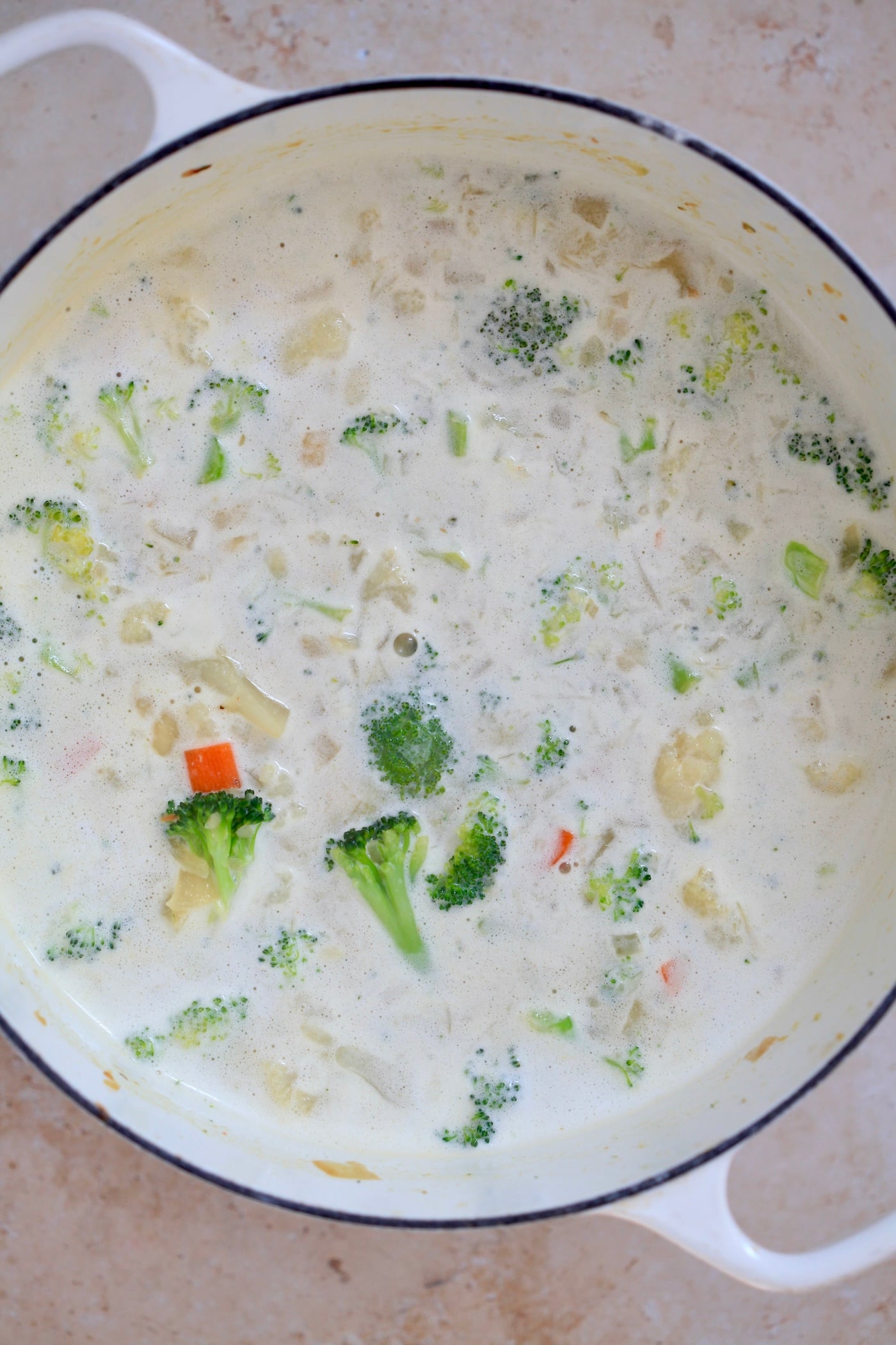 pot of creamy white soup with broccoli