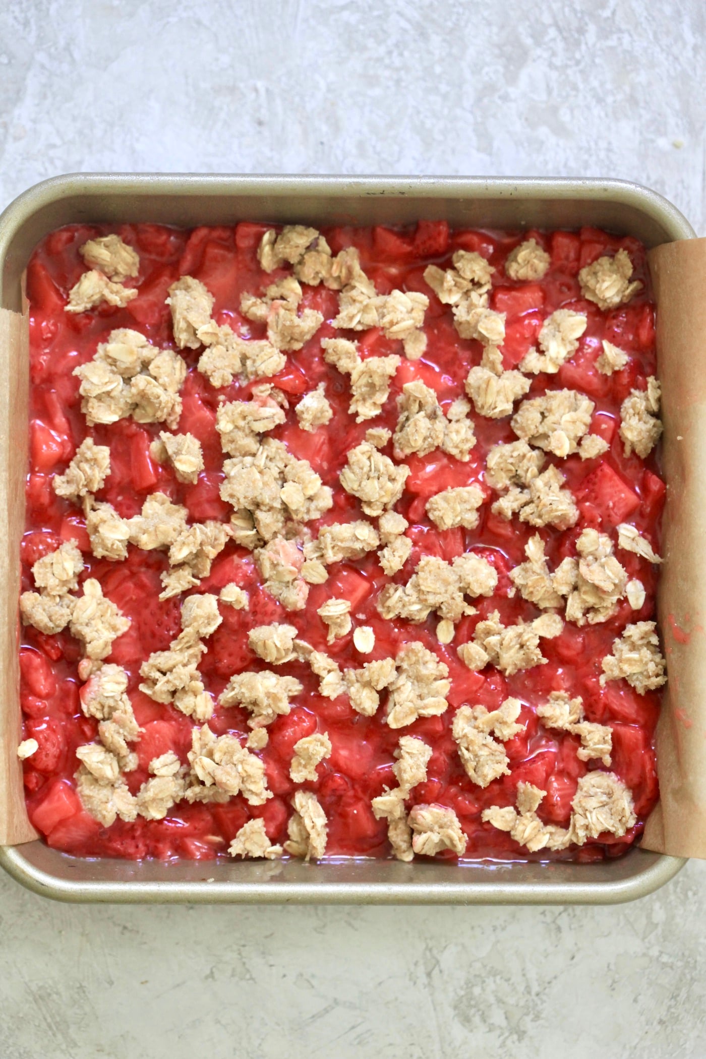 uncooked strawberry bars in pan