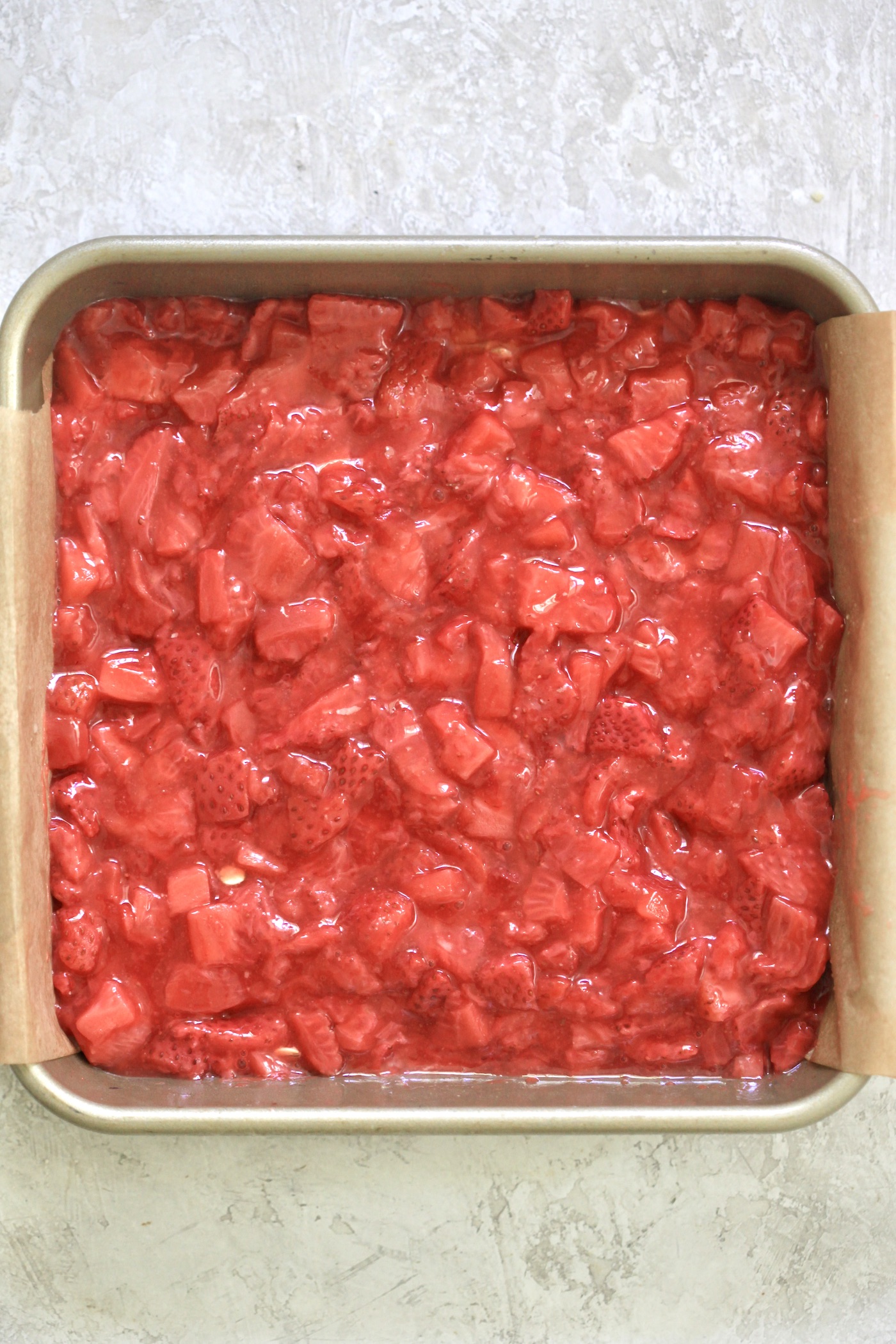 strawberries on dough in pan