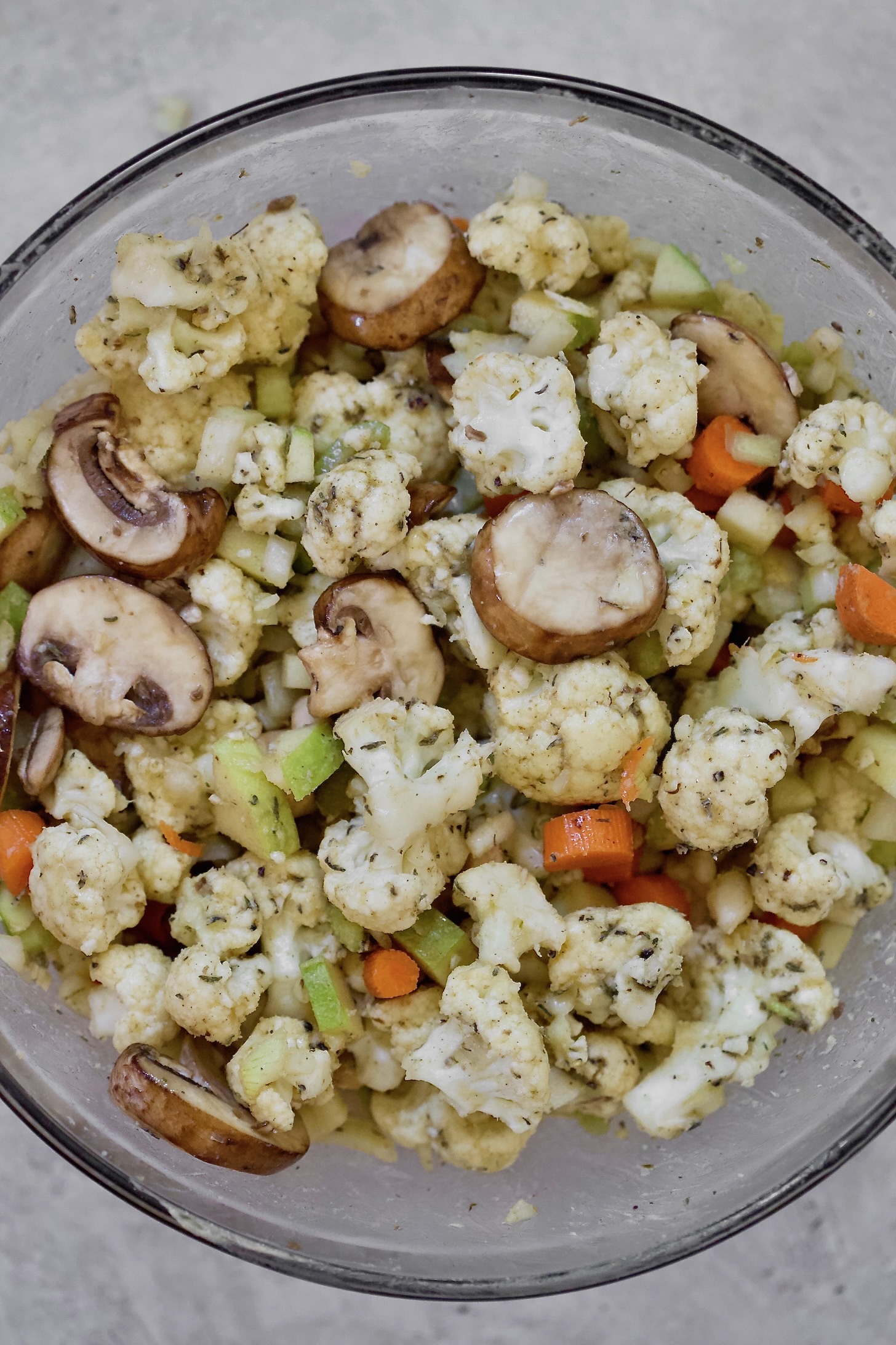 cauliflower and carrots chopped in mixing bowl.