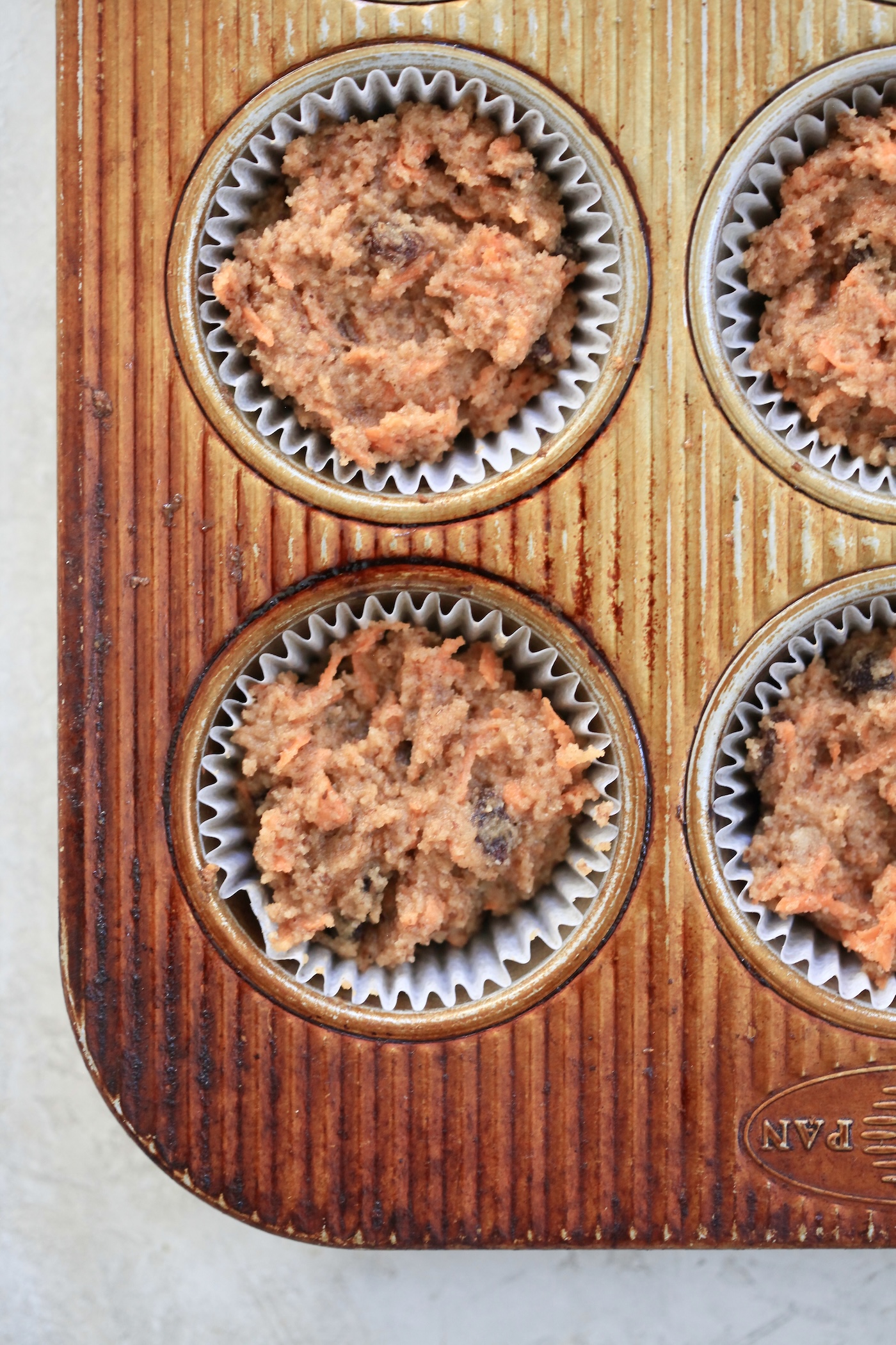 unbaked muffins in tin.