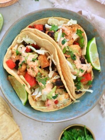 blue bowl with veggie stuffed tacos in it.