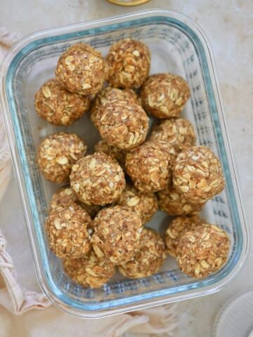glass container of brown oatmeal balls
