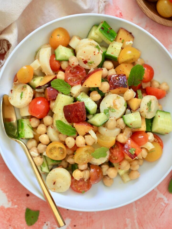 white bowl with chickpeas and colorful vegetables