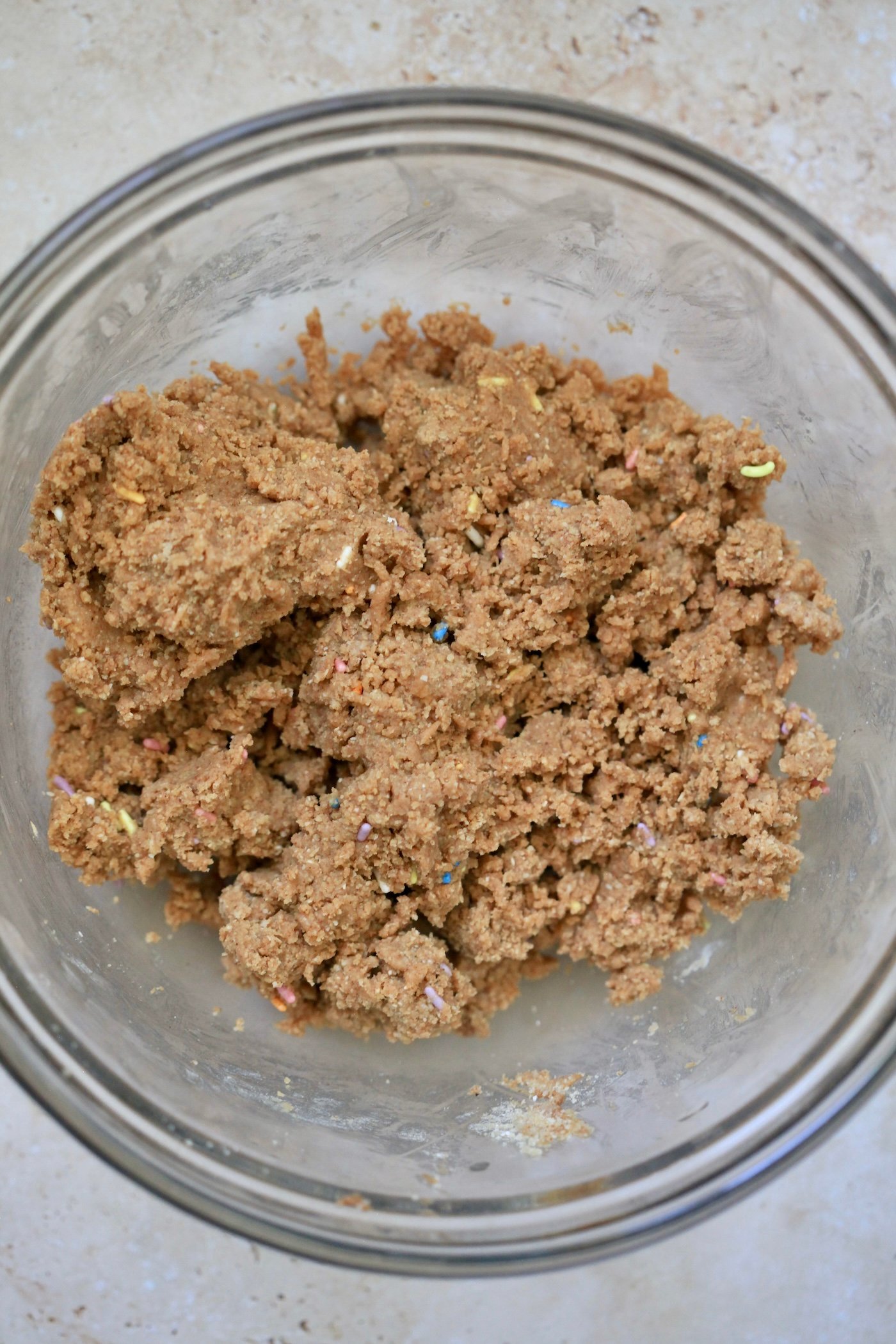 light brown dough in mixing bowl.