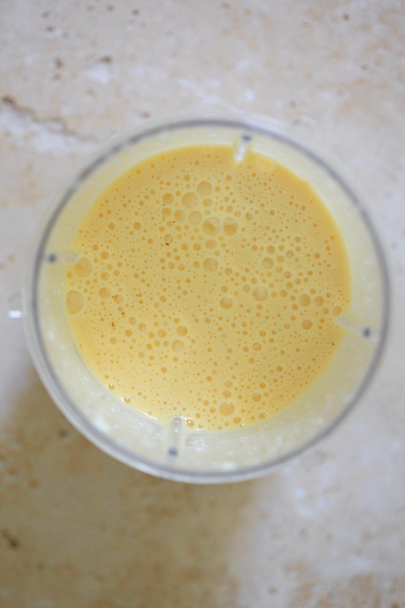 yellow blended mixture in blender