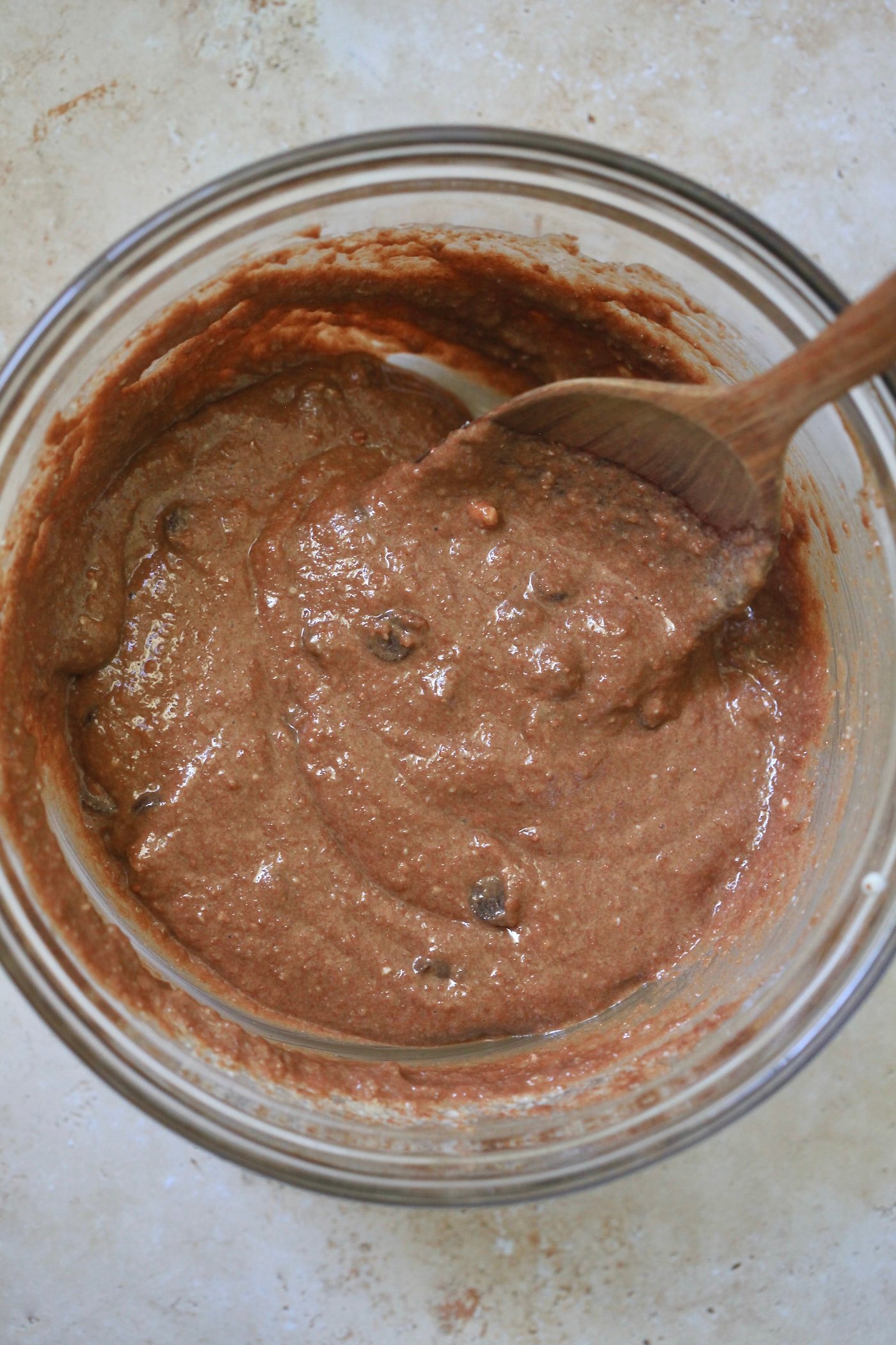 mixed chocolate batter with wooden spoon.