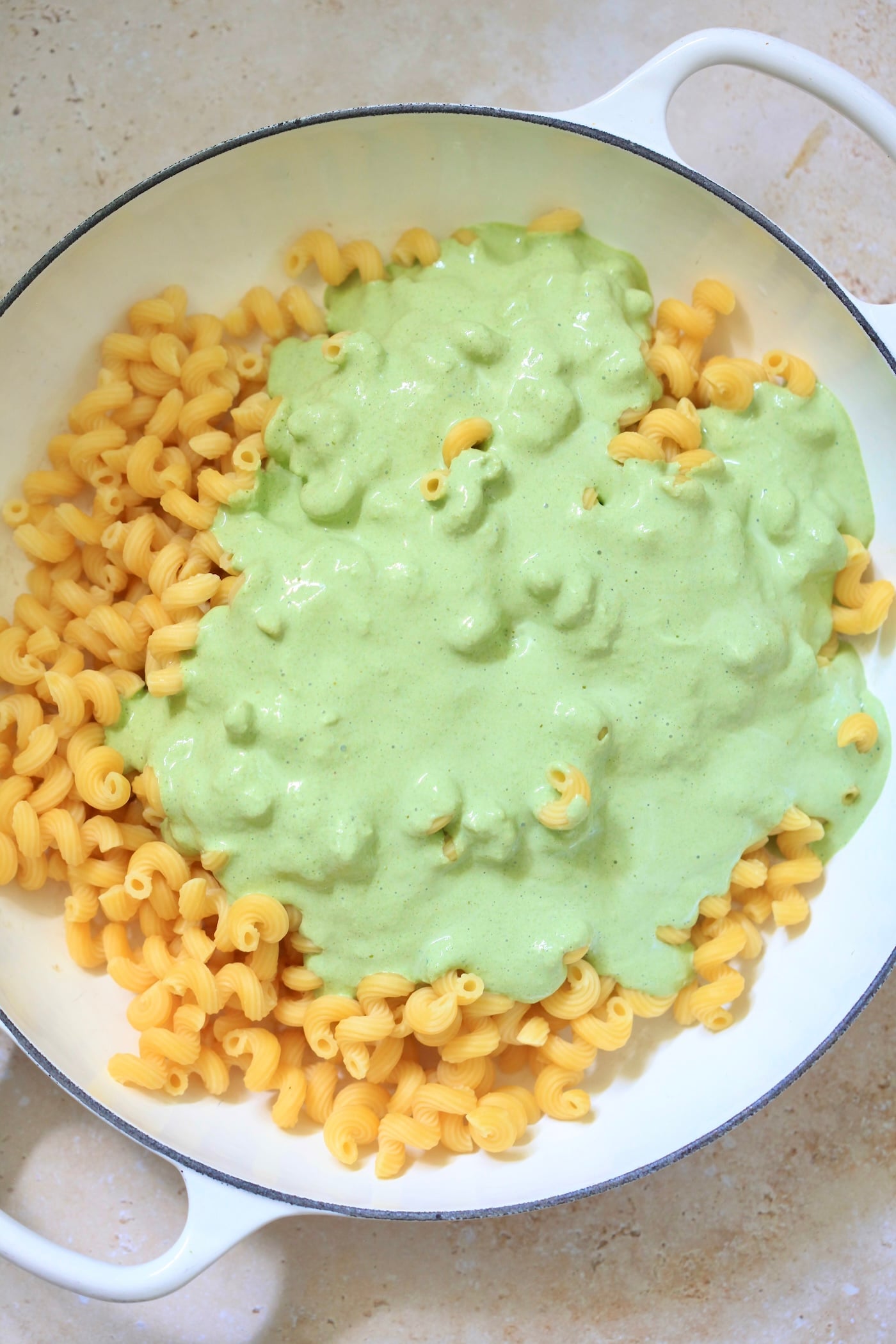 green sauce over noodles.