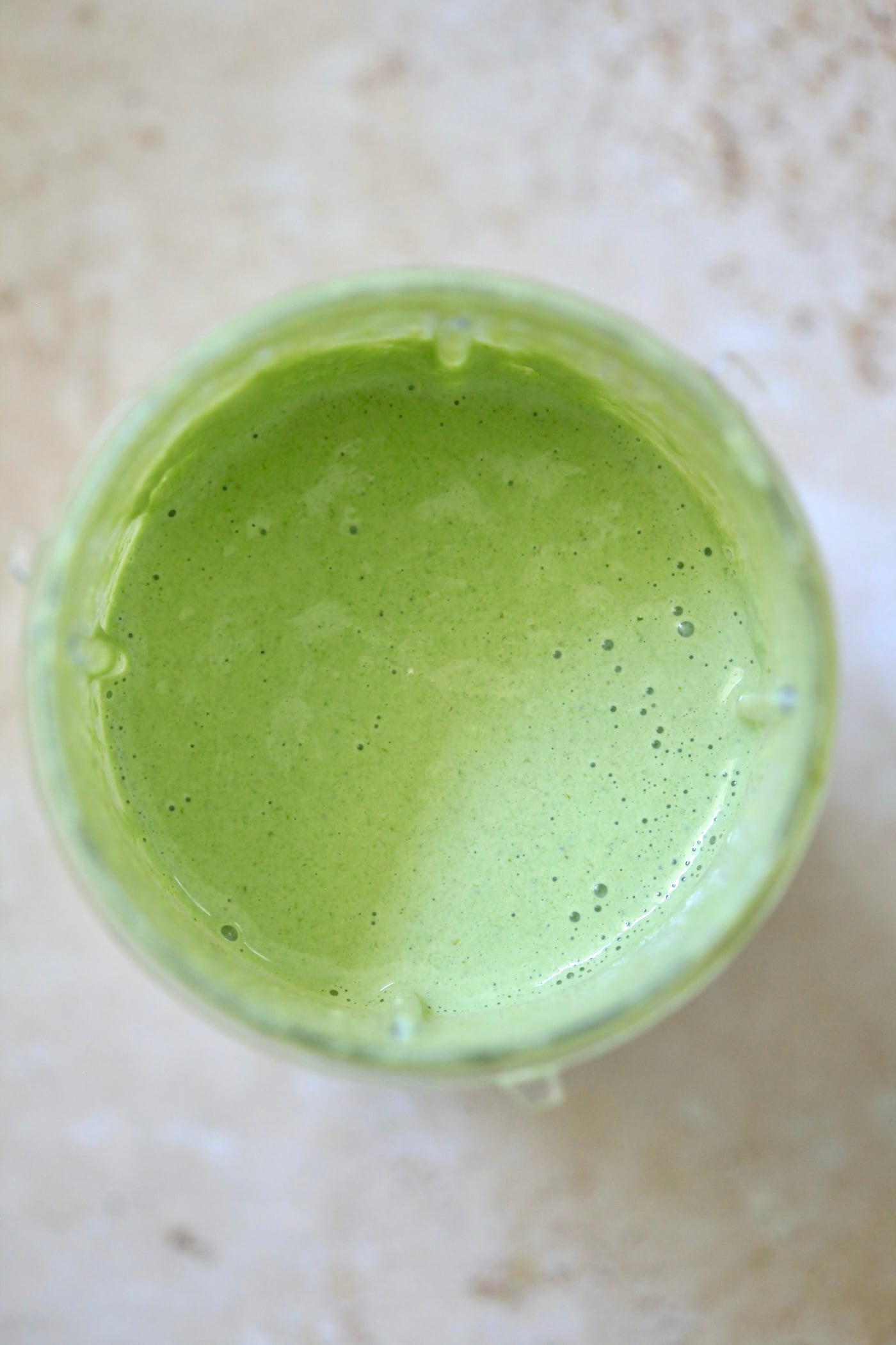 creamy light green sauce in blender.