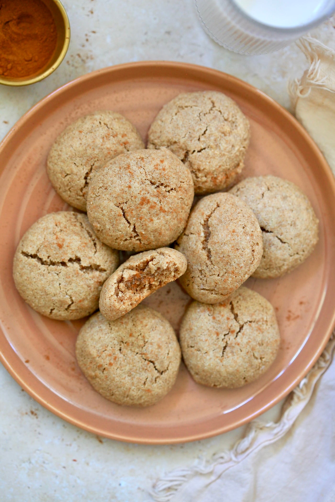 overhead view of plate of cookies with bite taken out