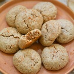 plate of cinnamon cookies with bite taken out.