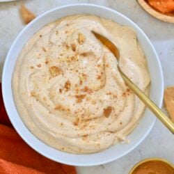 white bowl of light orange whipped pudding