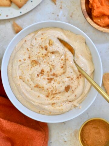 white bowl of light orange whipped pudding