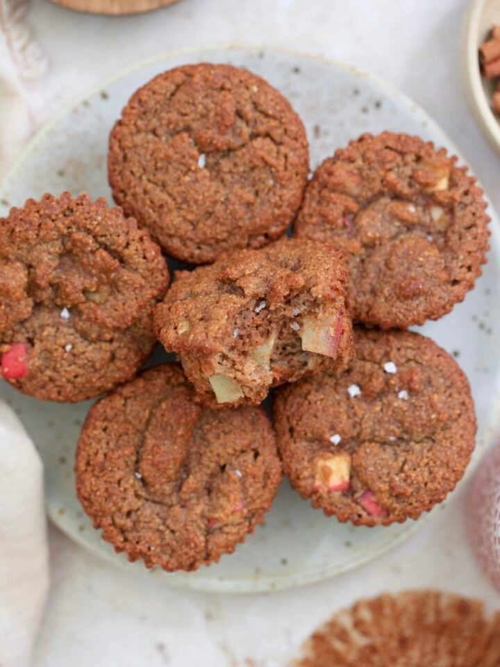 plate of brown muffins with bite taken out