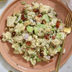 brown plate with tofu and quinoa mixture.