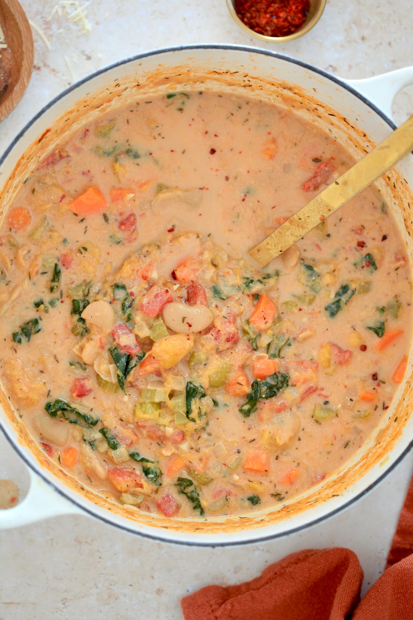 creamy pot of tomato soup with veggies