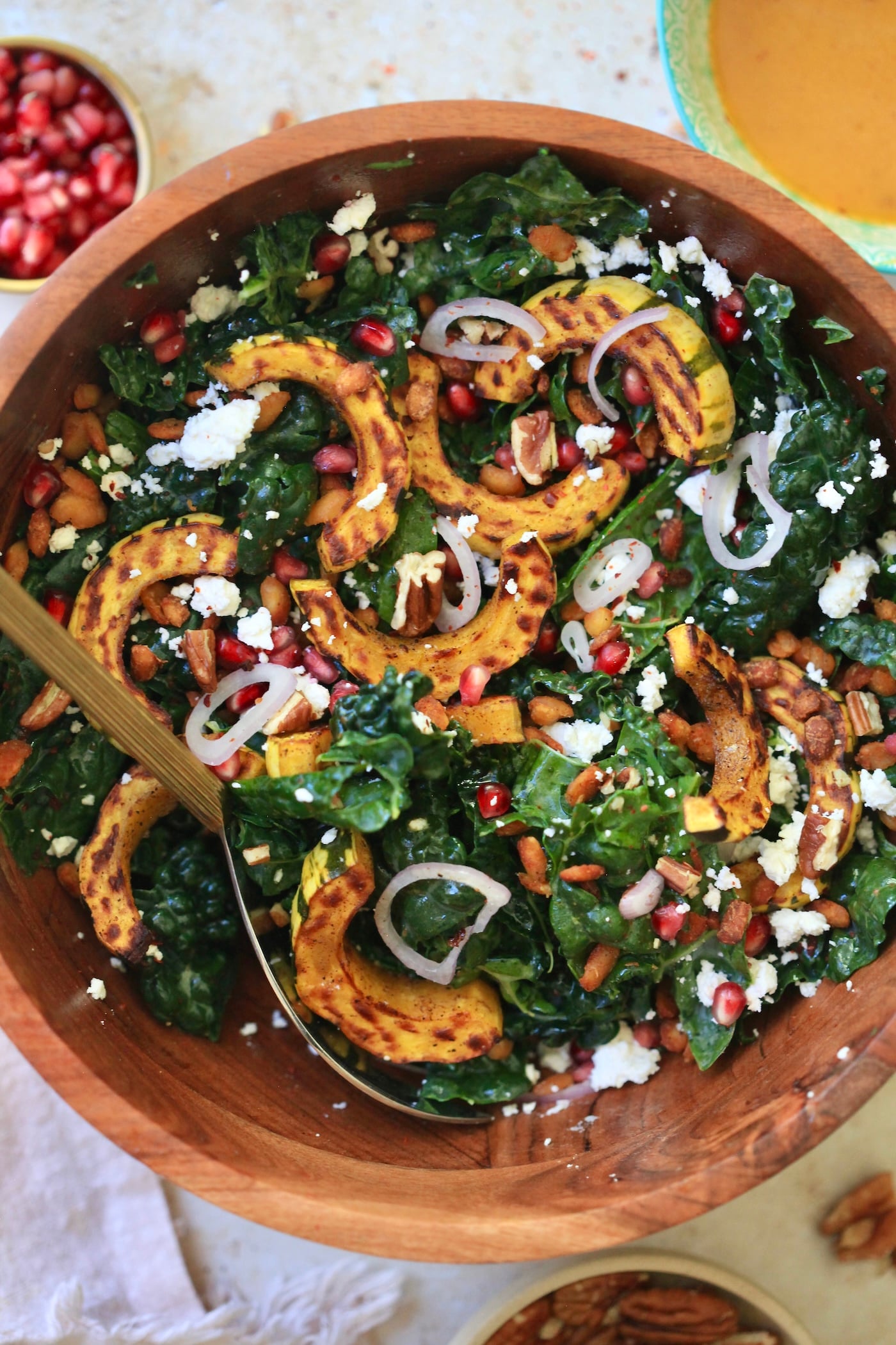 kale salad with squash in bowl