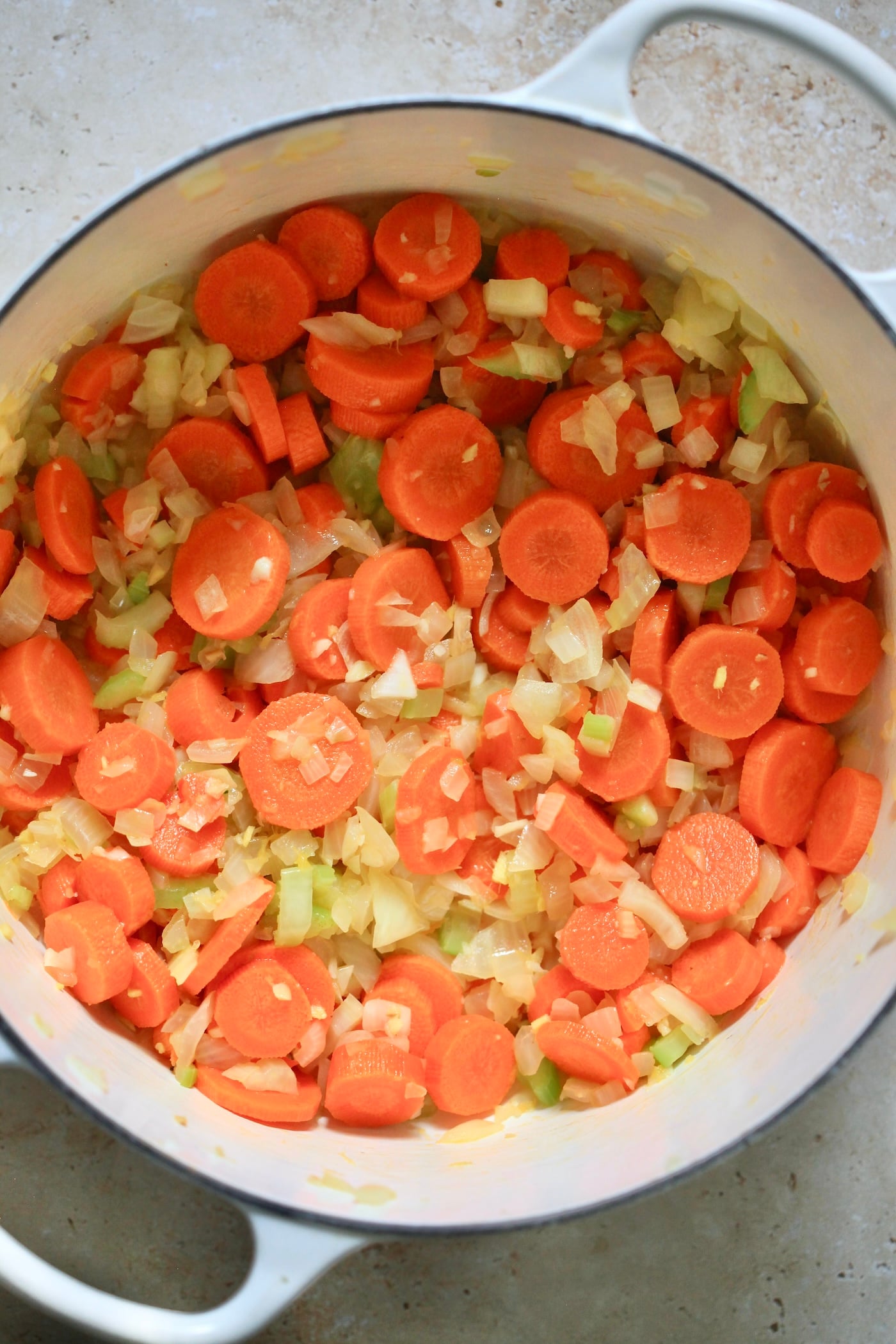onion, carrot and celery in pot.