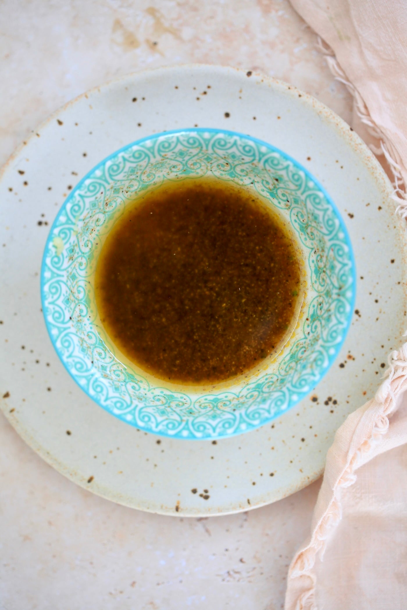 dark dressing in blue bowl.