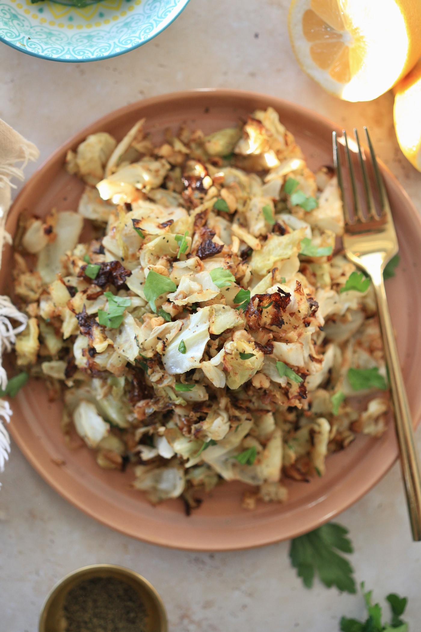 cabbage with green herbs on plate.