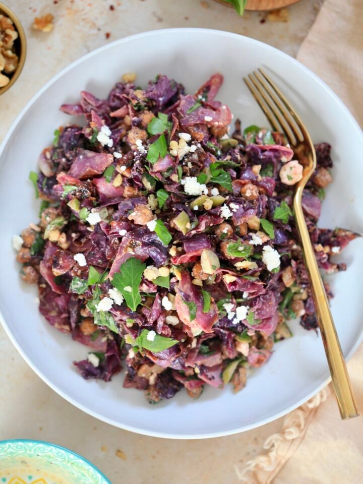 white bowl with purple cabbage salad.