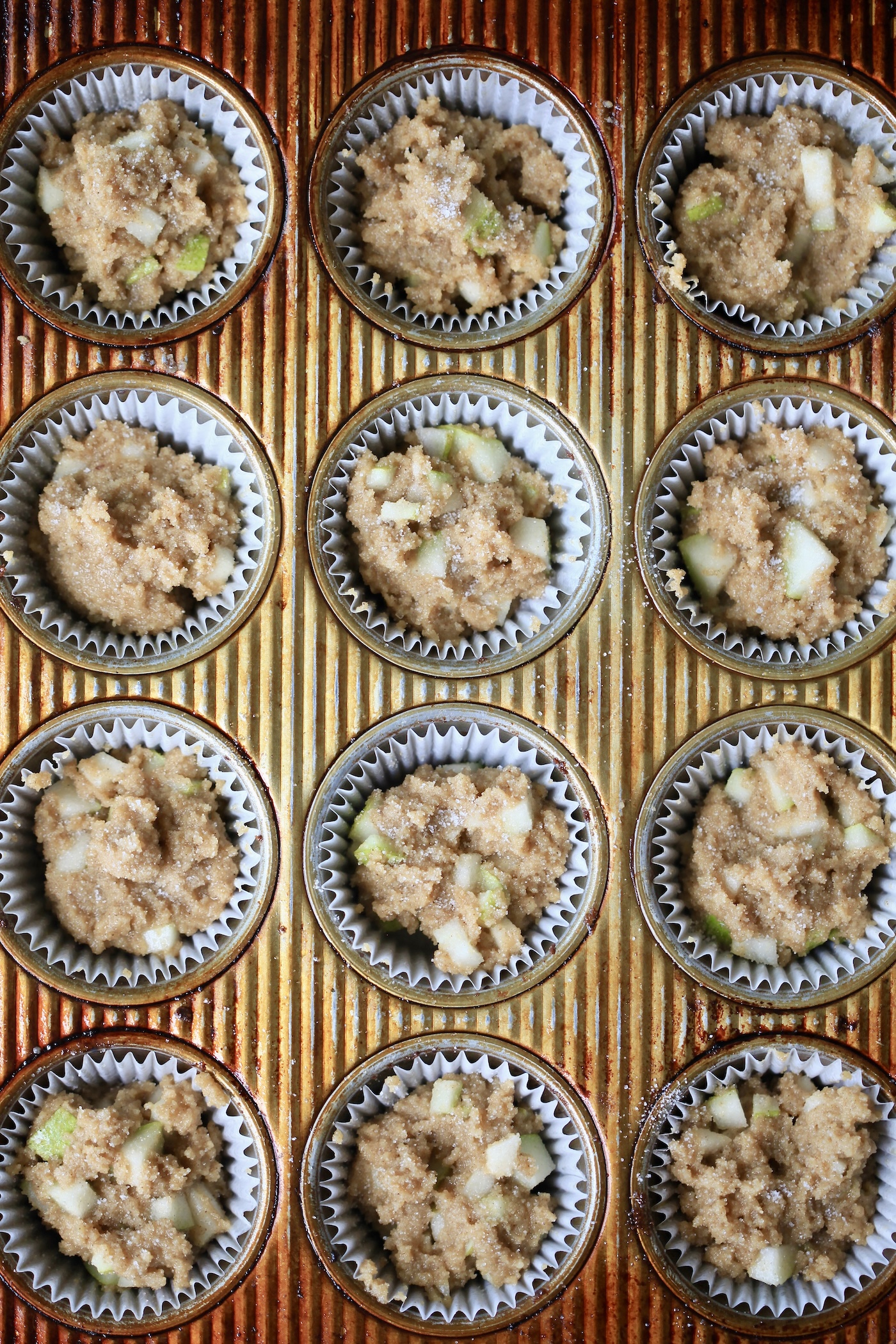 unbaked muffins in muffin tin.