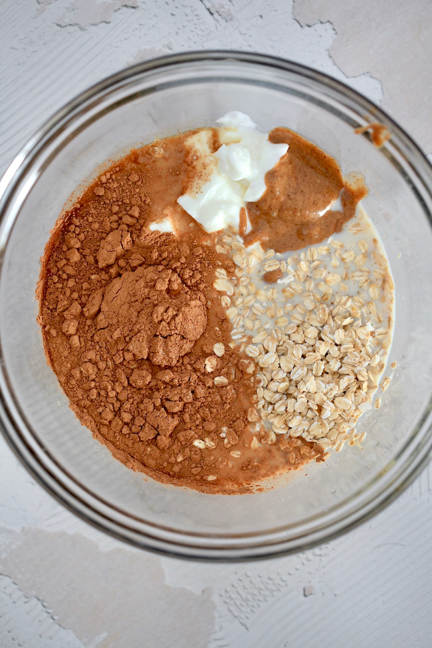 oats, yogurt, milk and cocoa in mixing bowl.