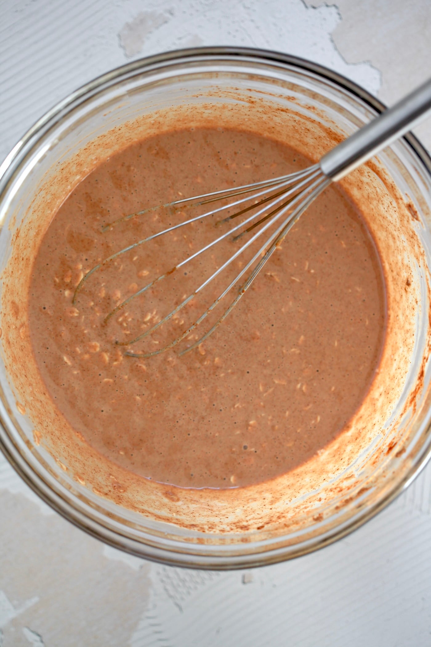 brown oat mixture in mixing bowl.