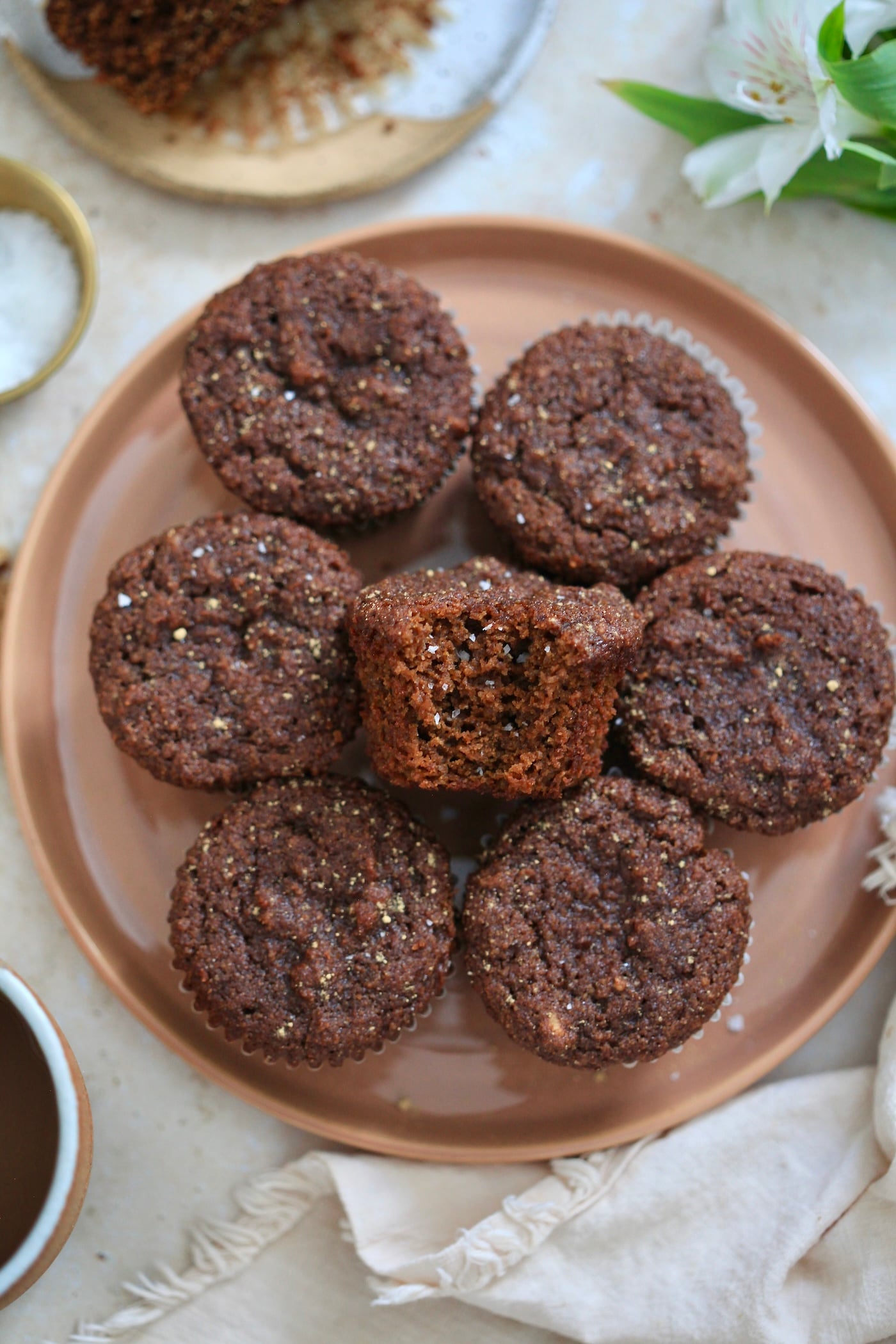 plate of gingerbread muffins with bite taken out.