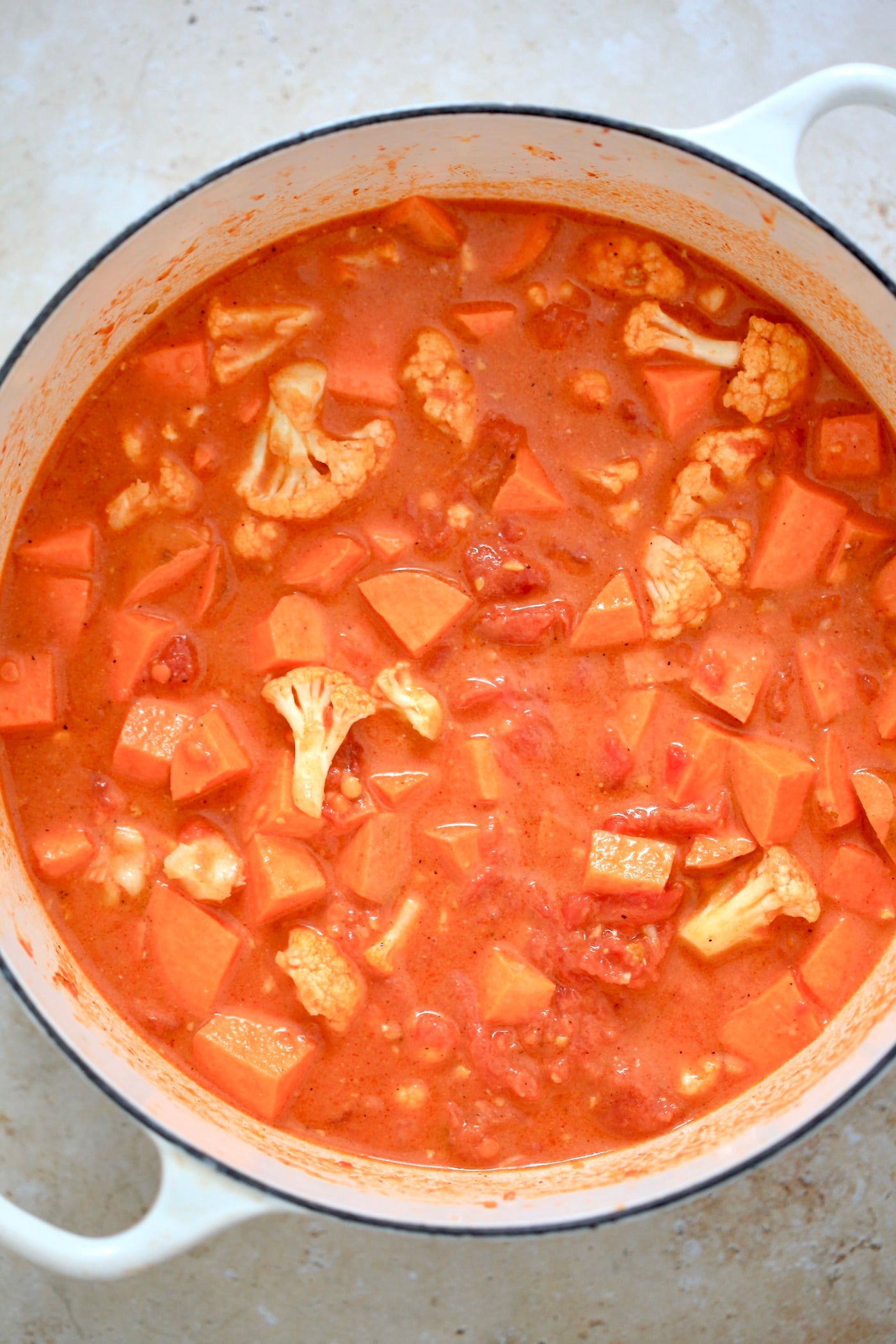 orange veggie mixture in pot.