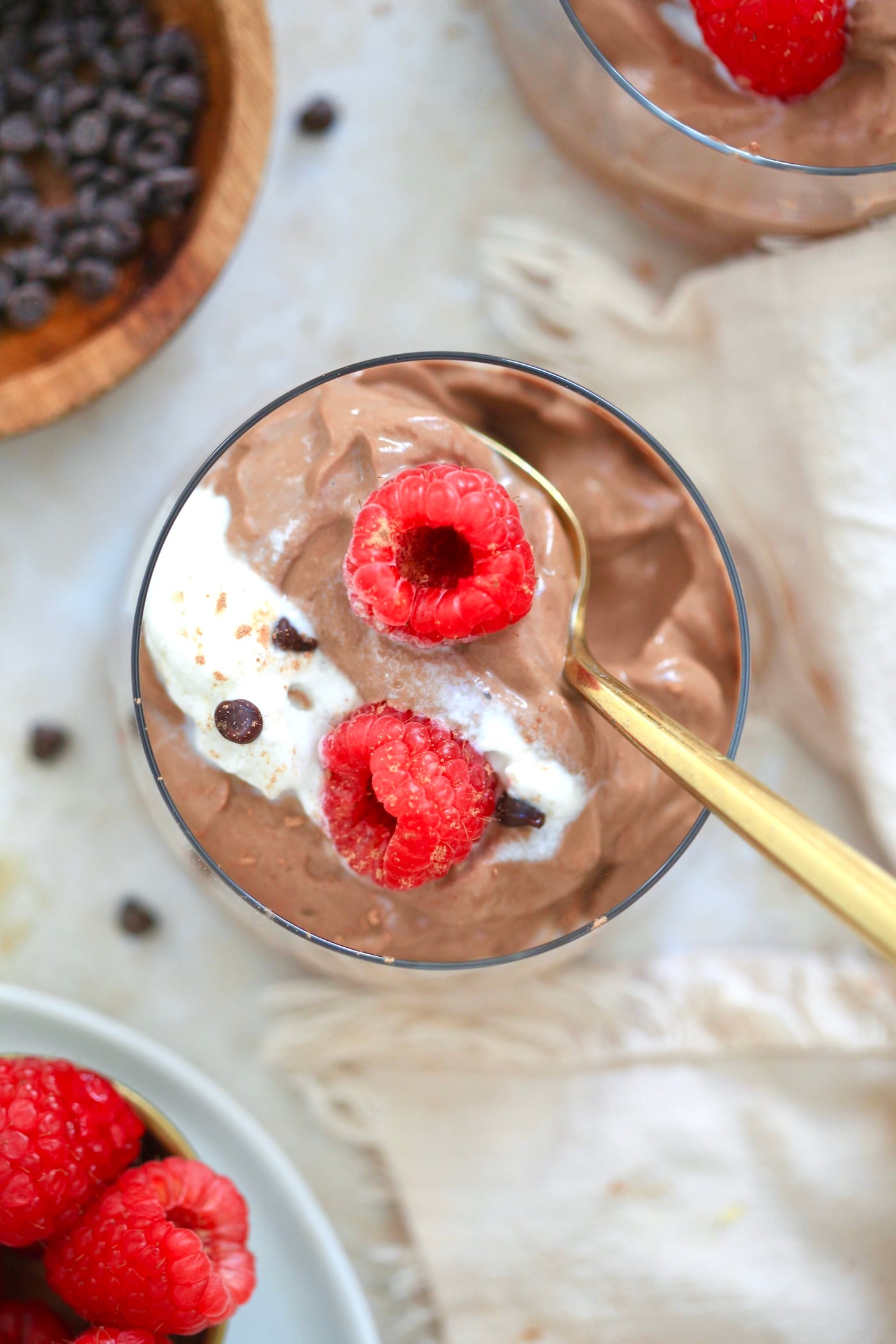 top down view of chocolate pudding with gold spoon.