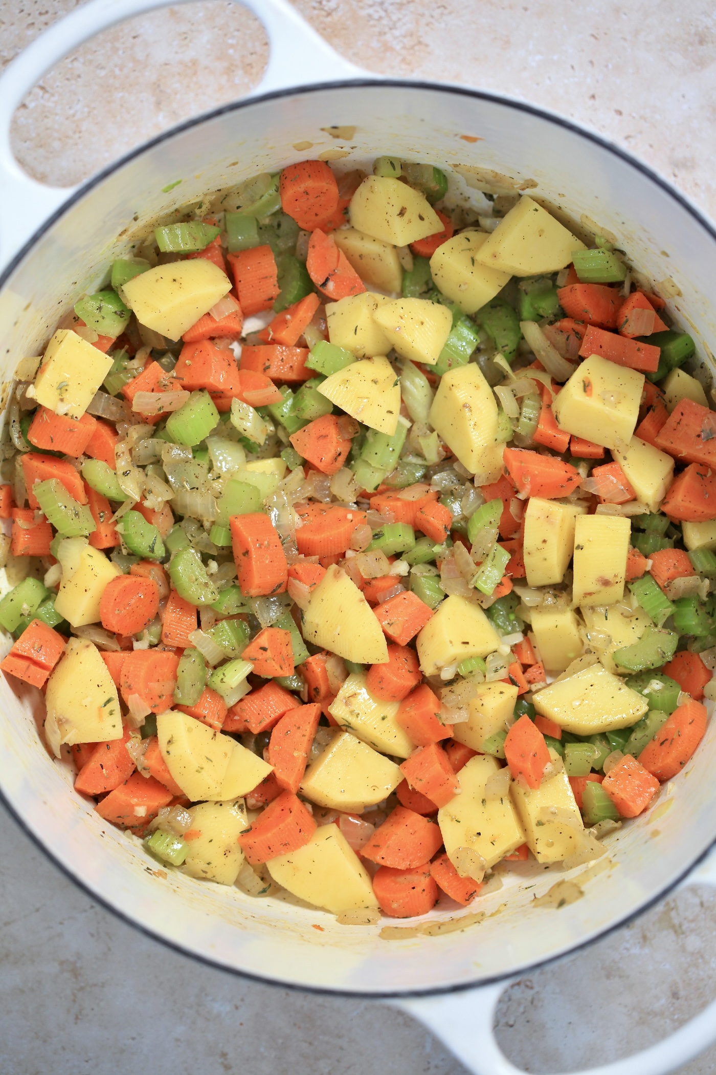 veggies and potatoes in pot.