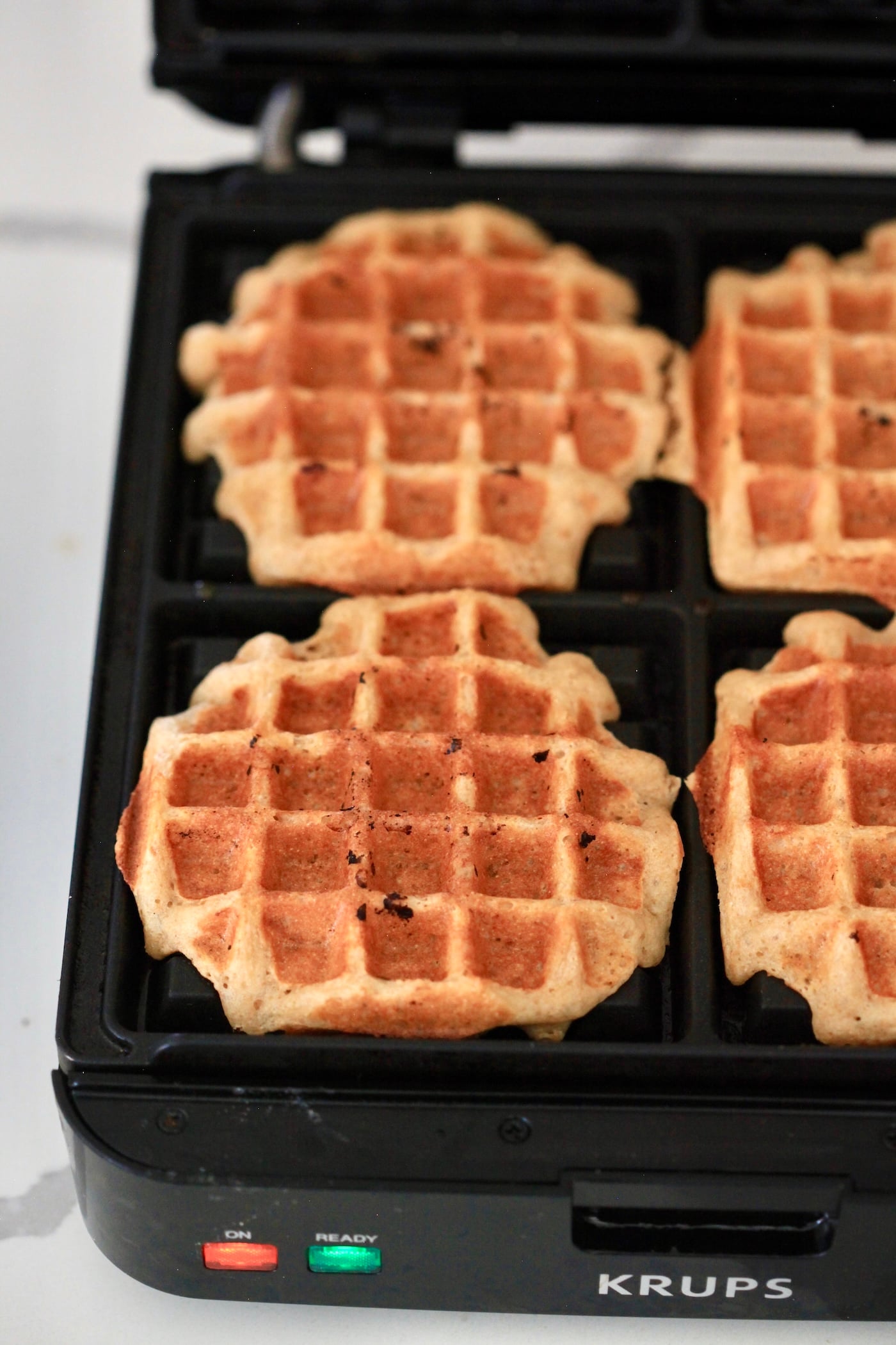 cooked waffle on waffle iron