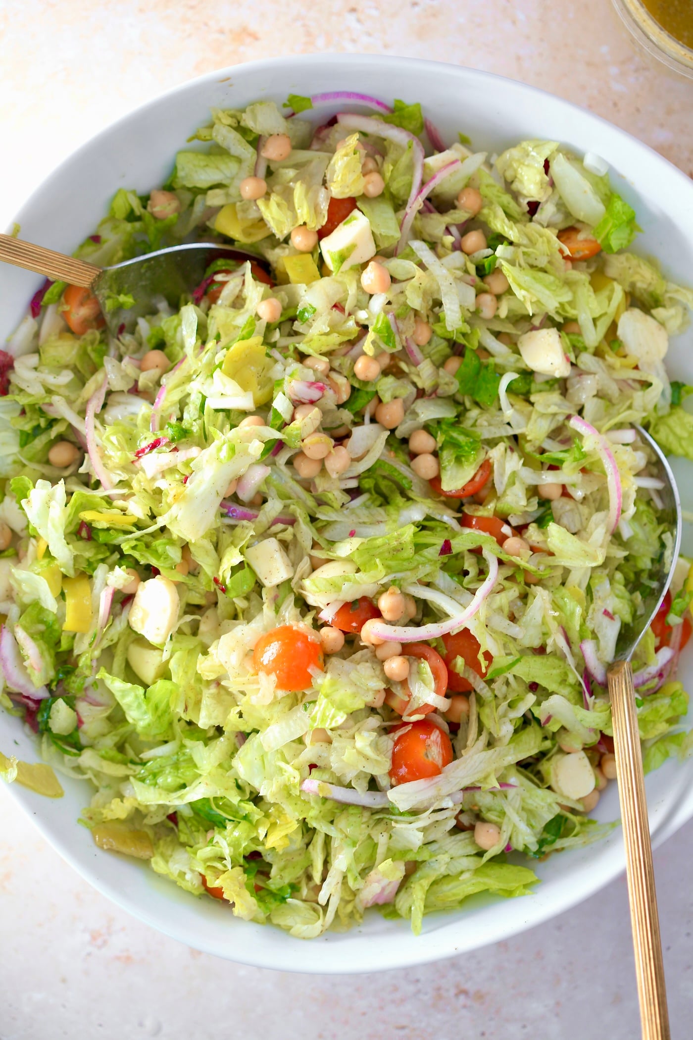 mixed salad in white bowl.