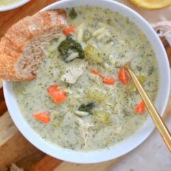 white bowl with creamy soup and lemon in background.