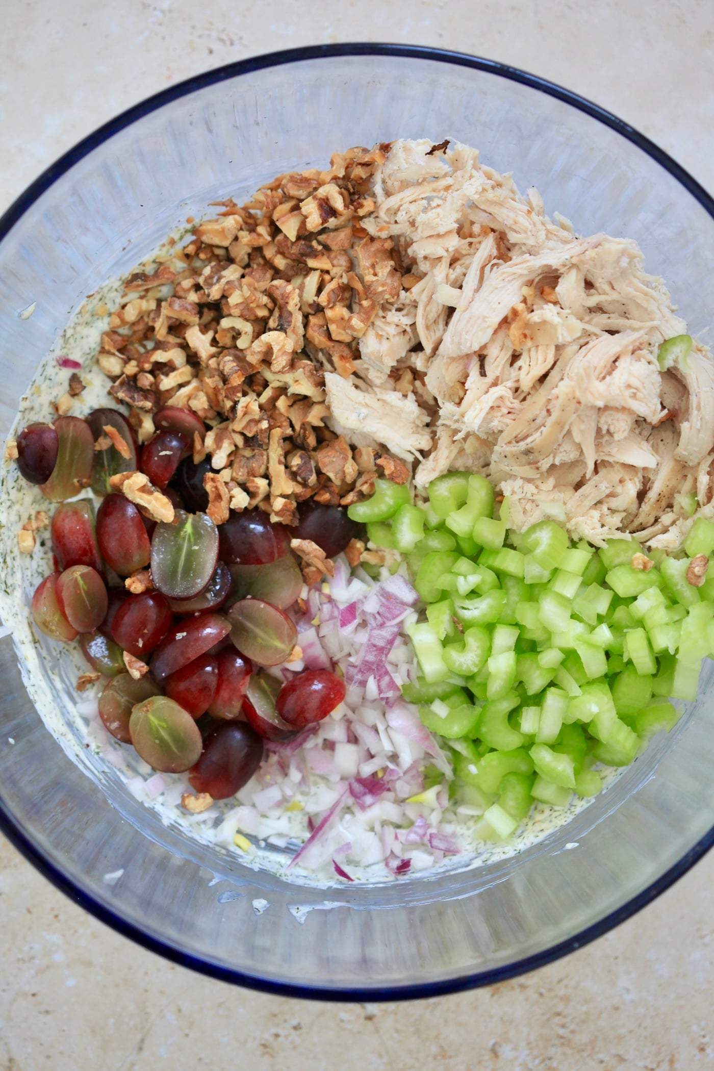 chicken, yogurt, veggies and walnuts in mixing bowl.