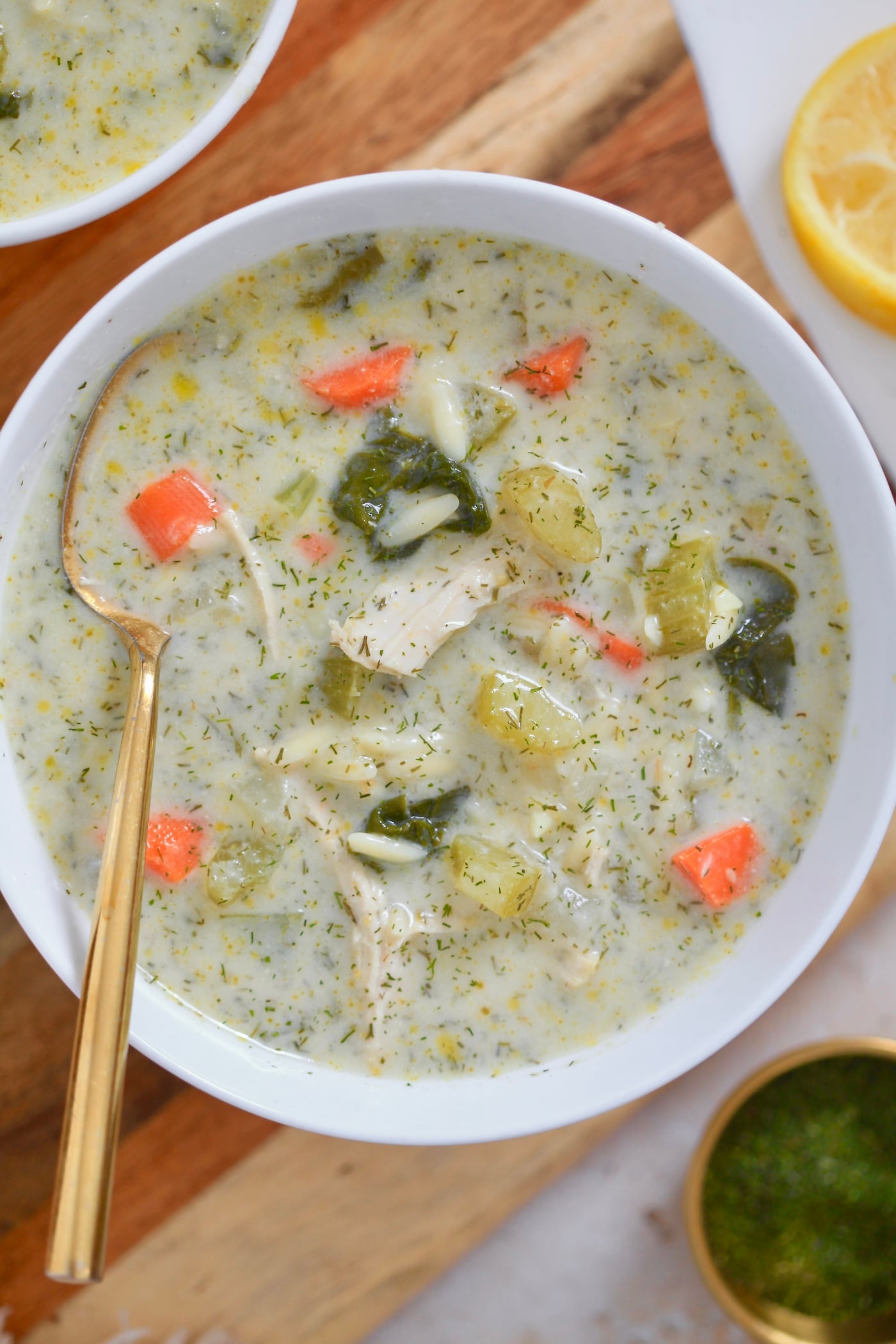 bowl of creamy soup on wooden board.