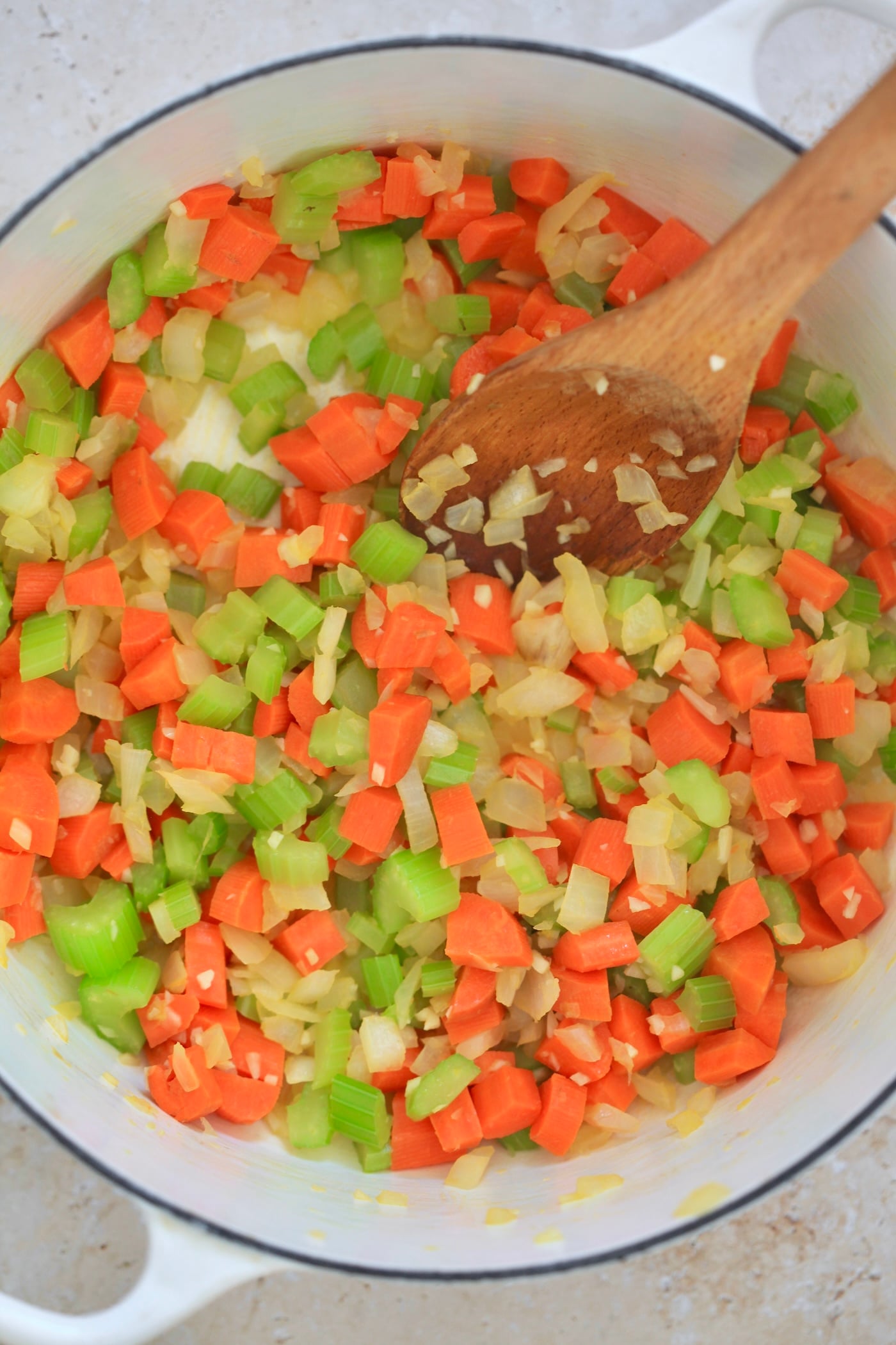 mirepoix sautéing in pot.