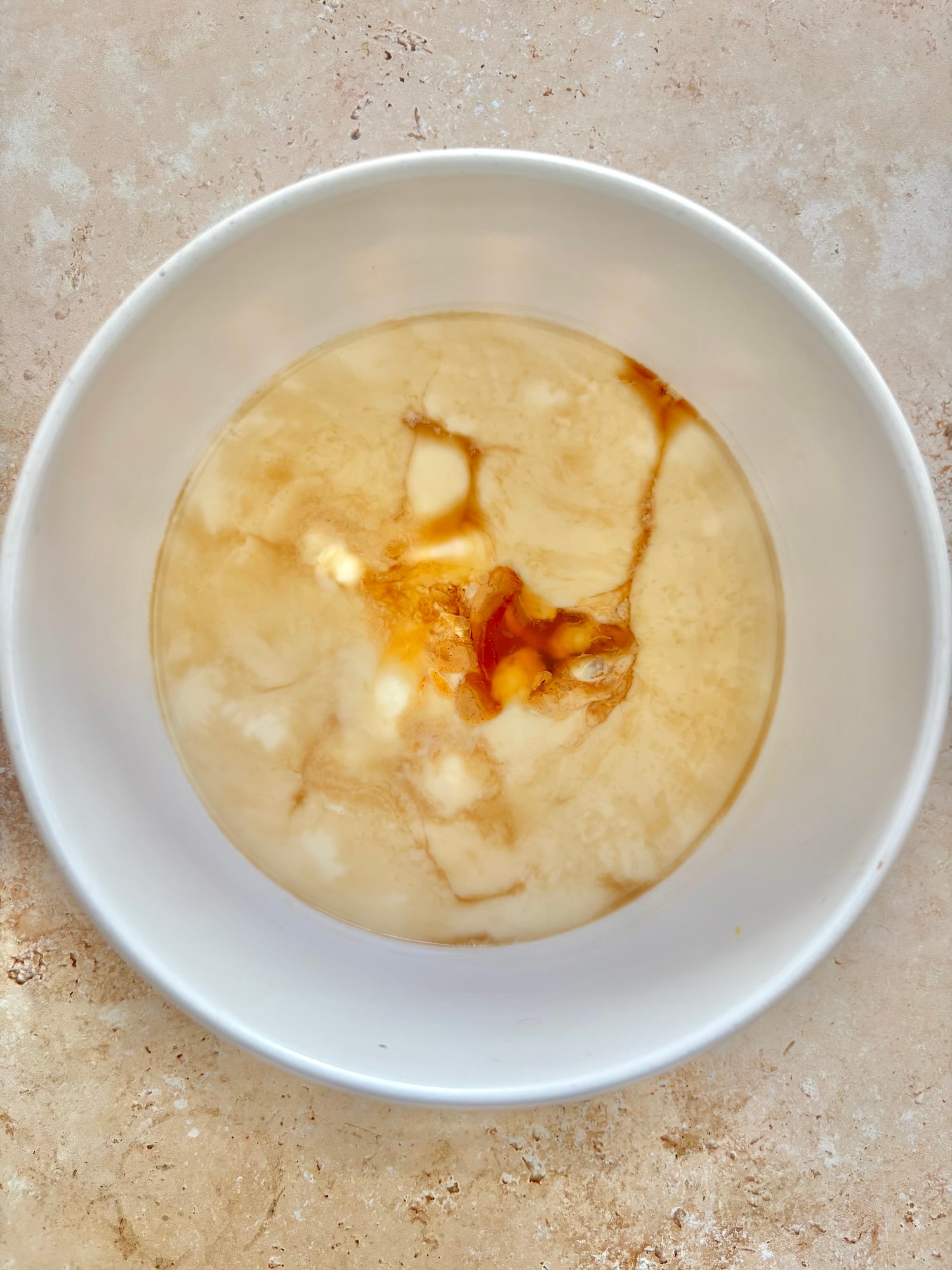 milk and vanilla in mixing bowl.
