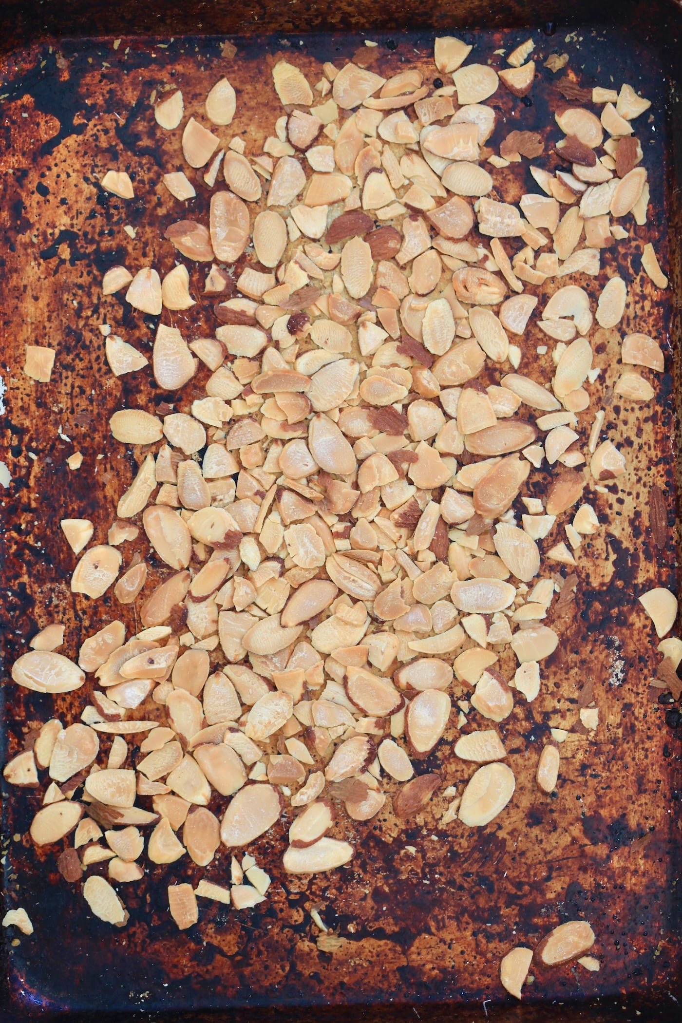 browned slivered almonds on baking sheet.
