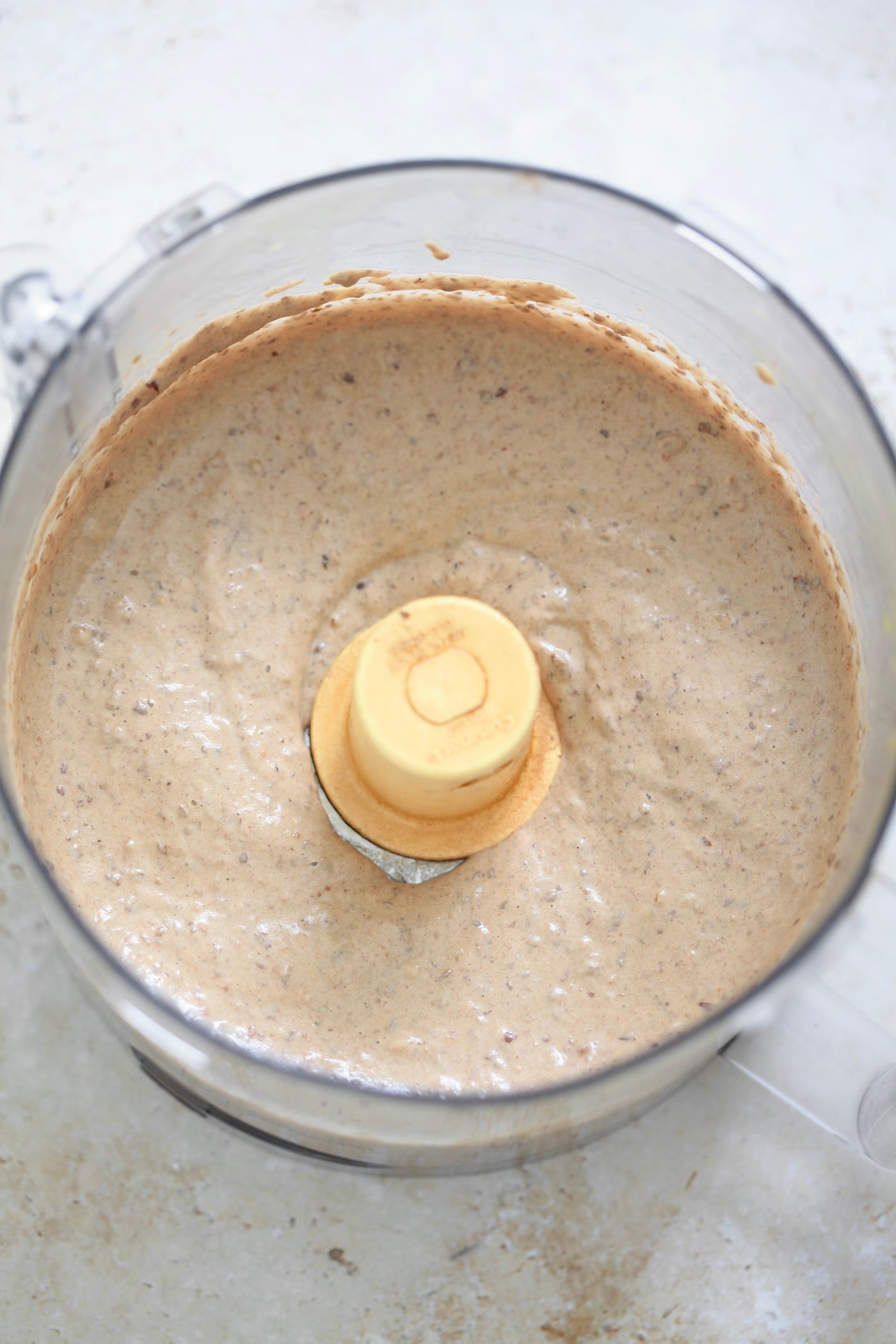 light brown mixture in food processor.