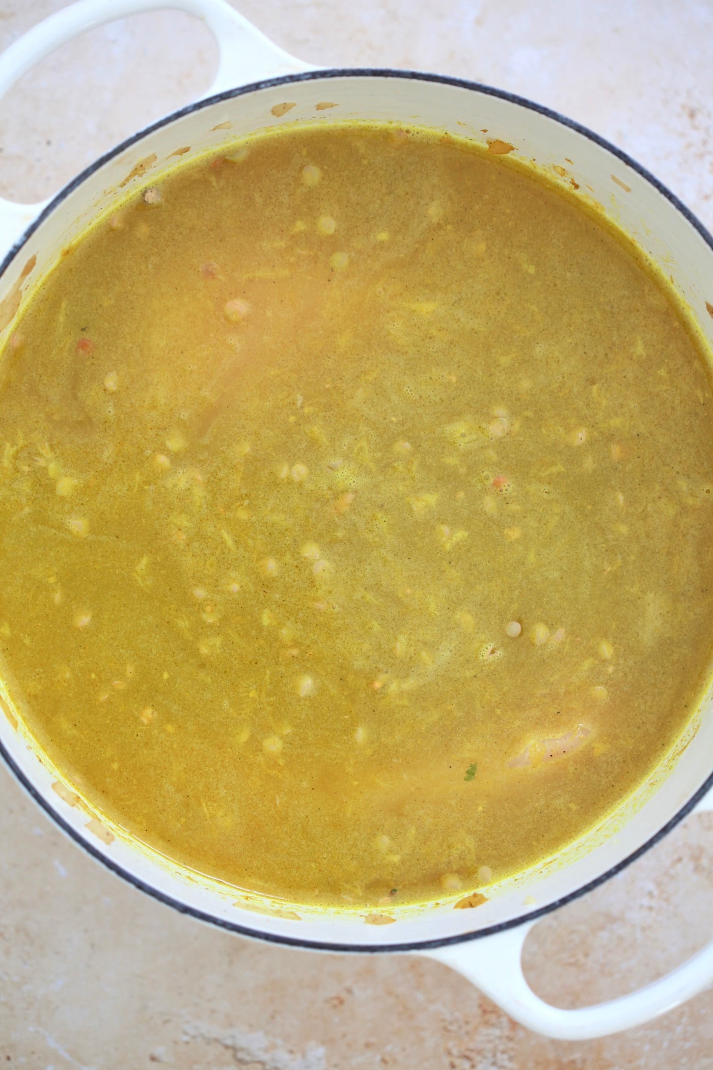 yellow soup in pot.